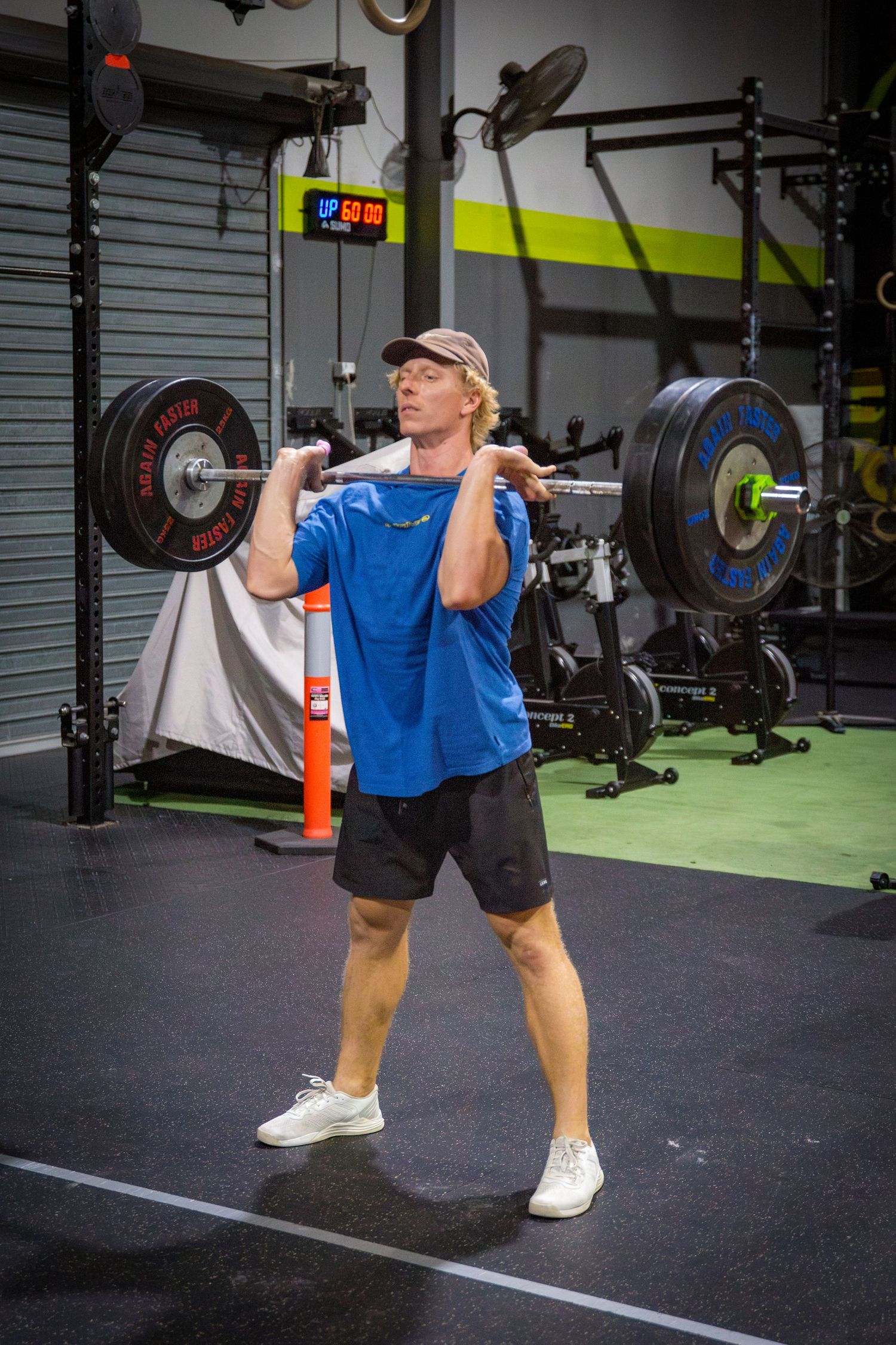 Gym member barbell workout at CQ Fitness Co during high-energy workout