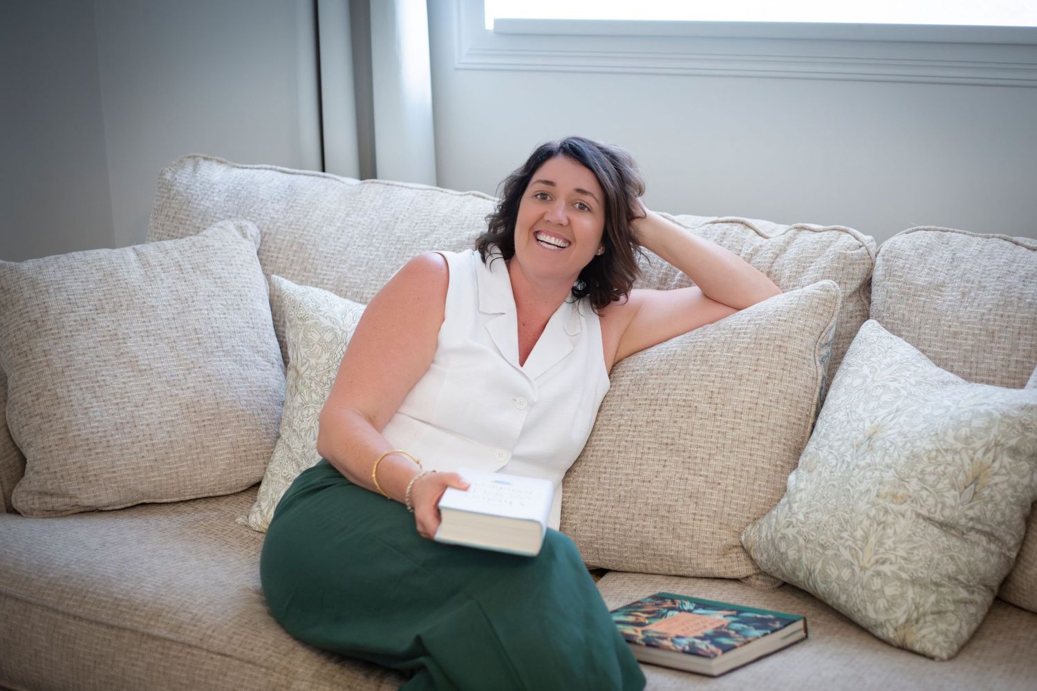 Personal branding portrait of a woman preparing food in a light-filled Rockhampton lounge room , captured with a clean, minimal style