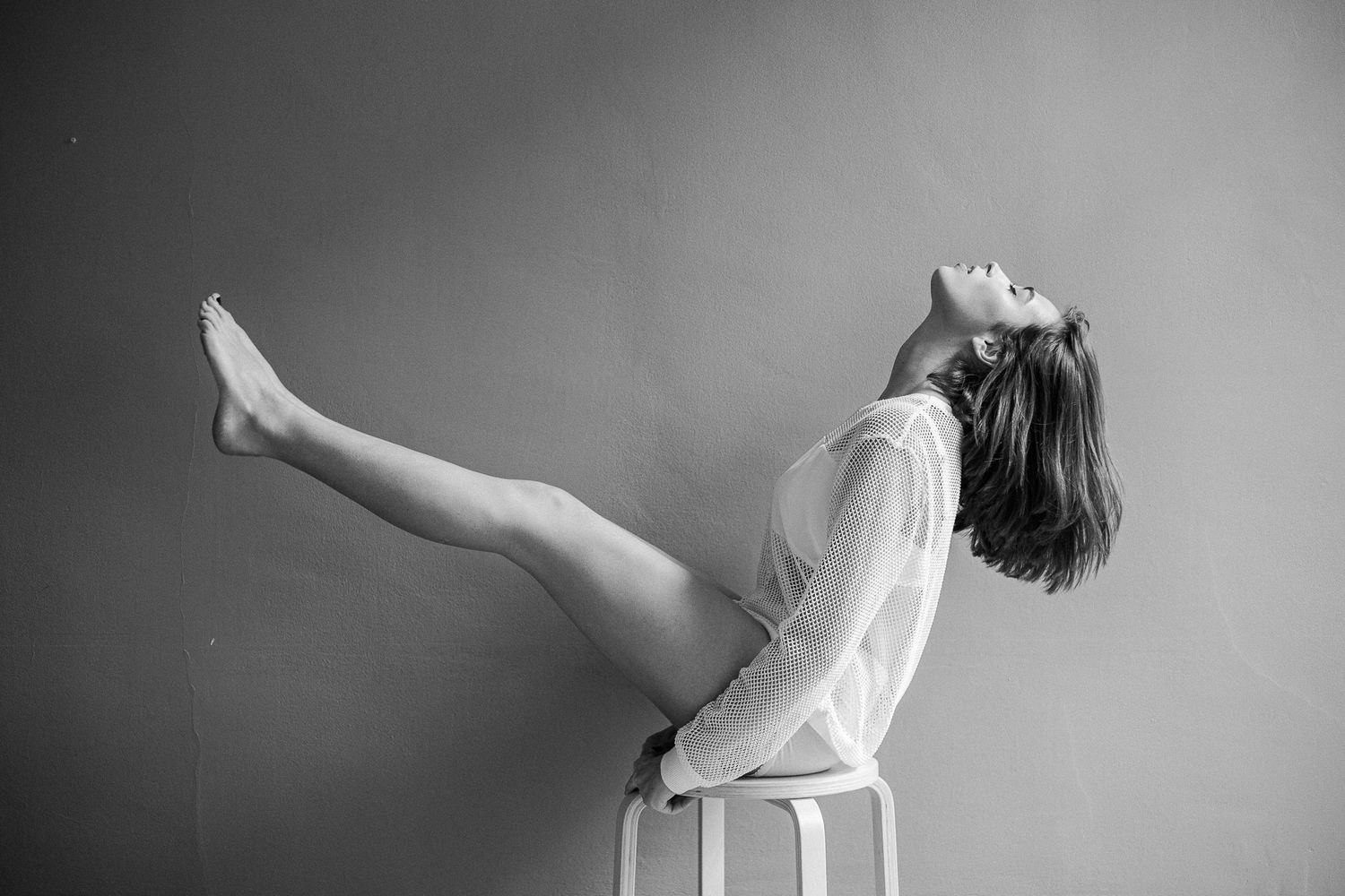 Black and white photo sequence showing graceful ballet dance movements with flowing fabric and dramatic poses.