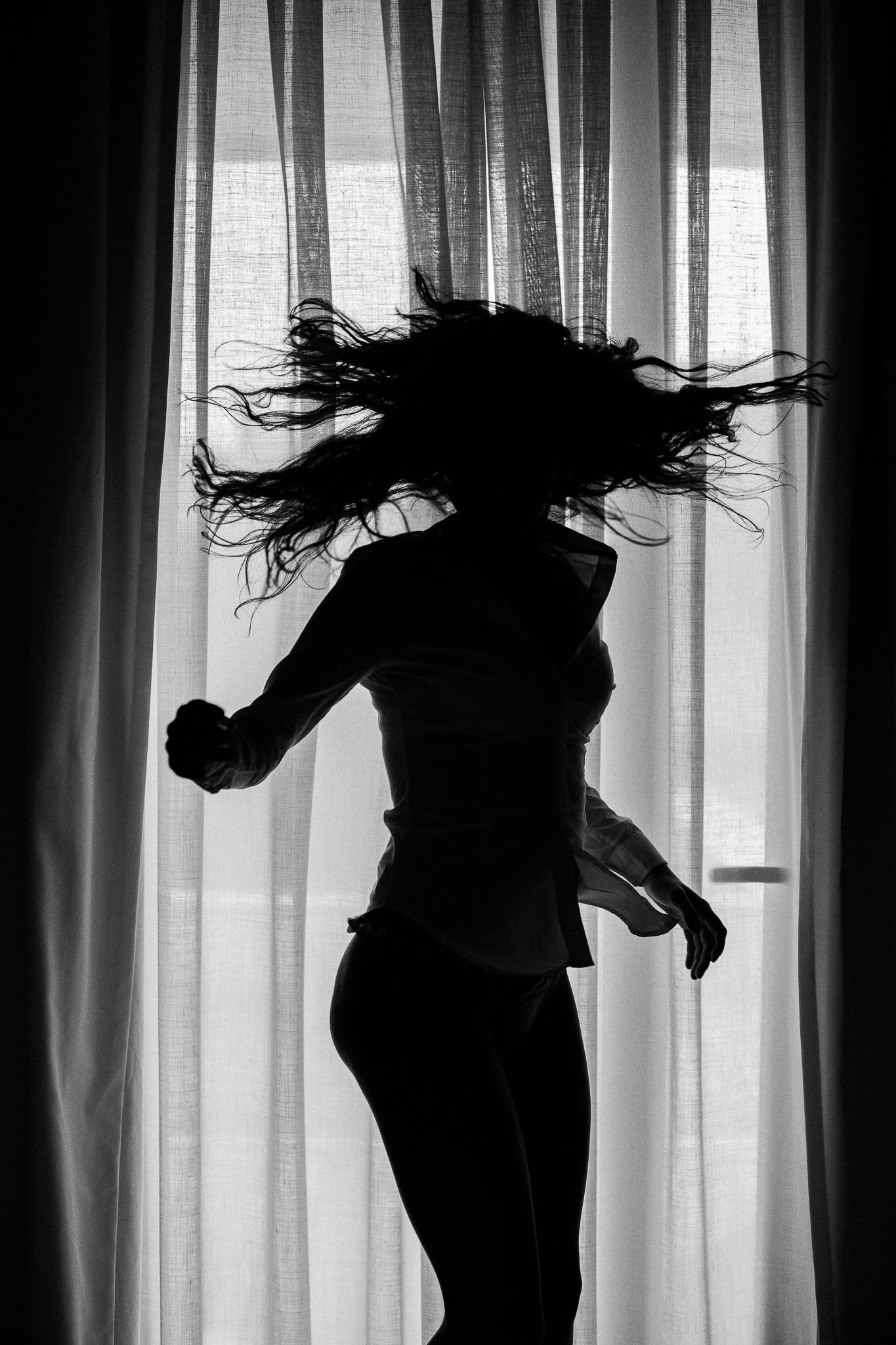 Dynamic silhouette series showing hair flips against backlit curtains.