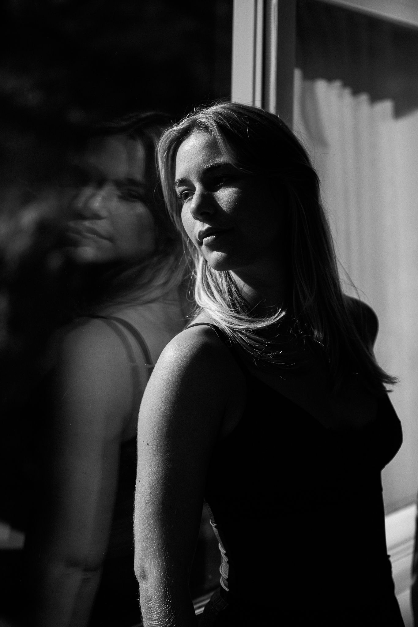 A series of black and white photos showing a silhouette of a person in dramatic side lighting.