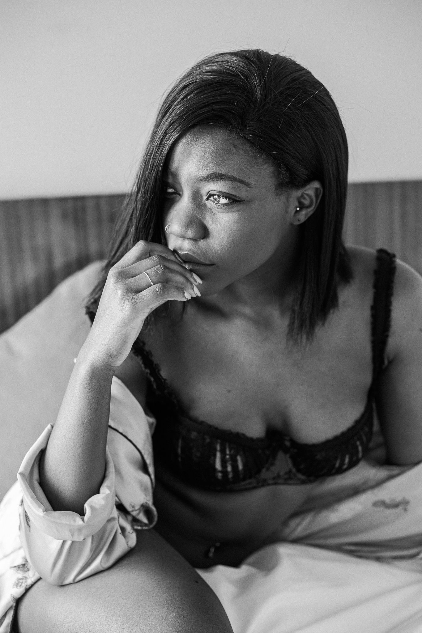 A black and white photo series showing someone reclining and resting their head on their hand in different poses.