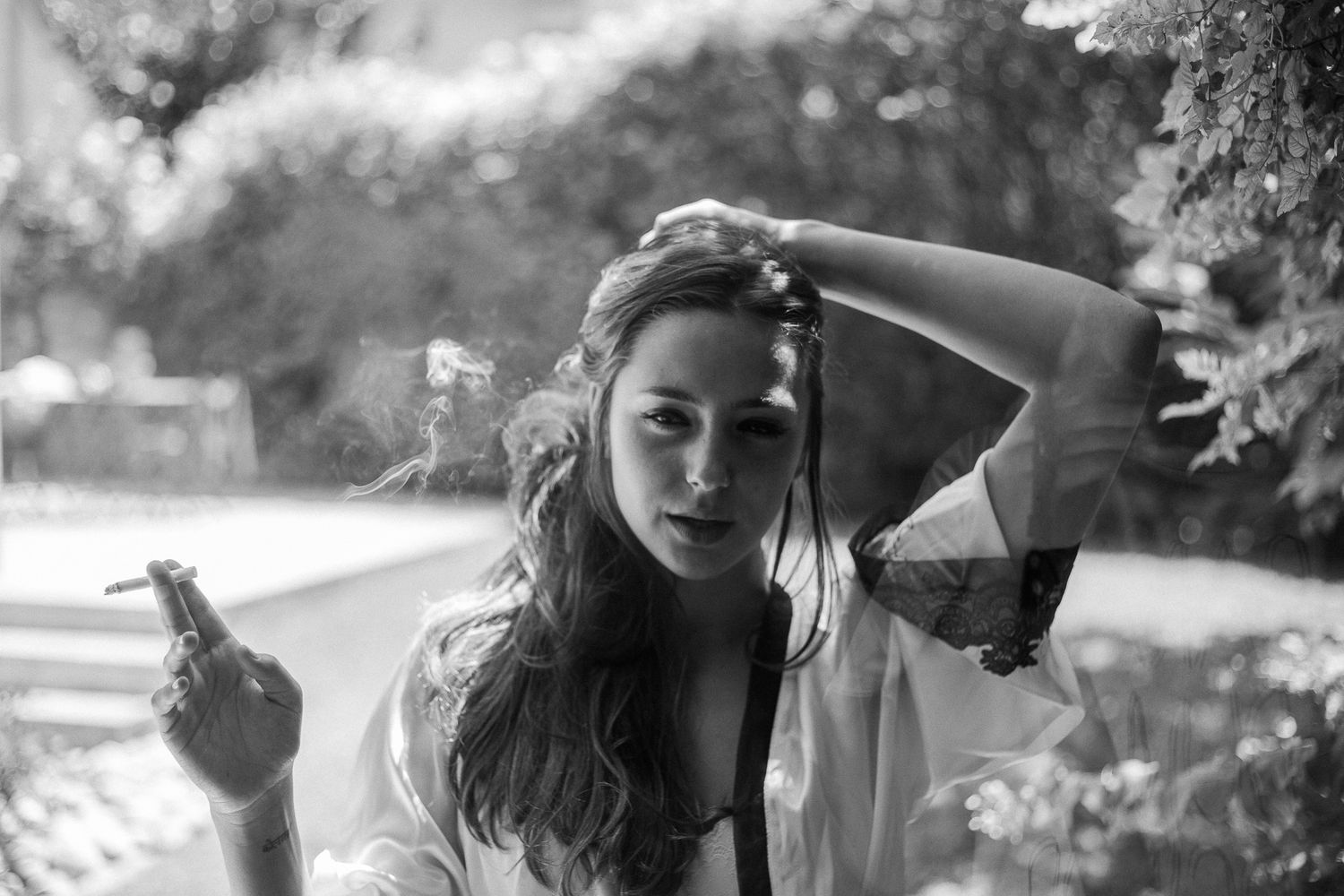 Black and white collage of wedding photos showing candid moments and celebrations outdoors.