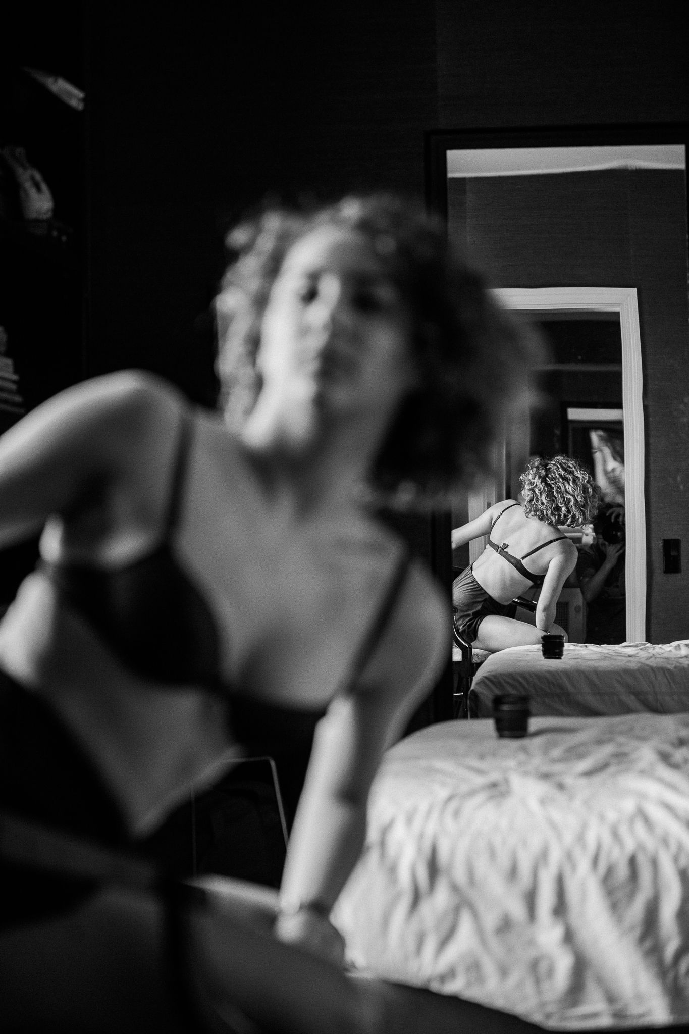 A series of black and white photographs showing an intimate bedroom scene in progressive frames.
