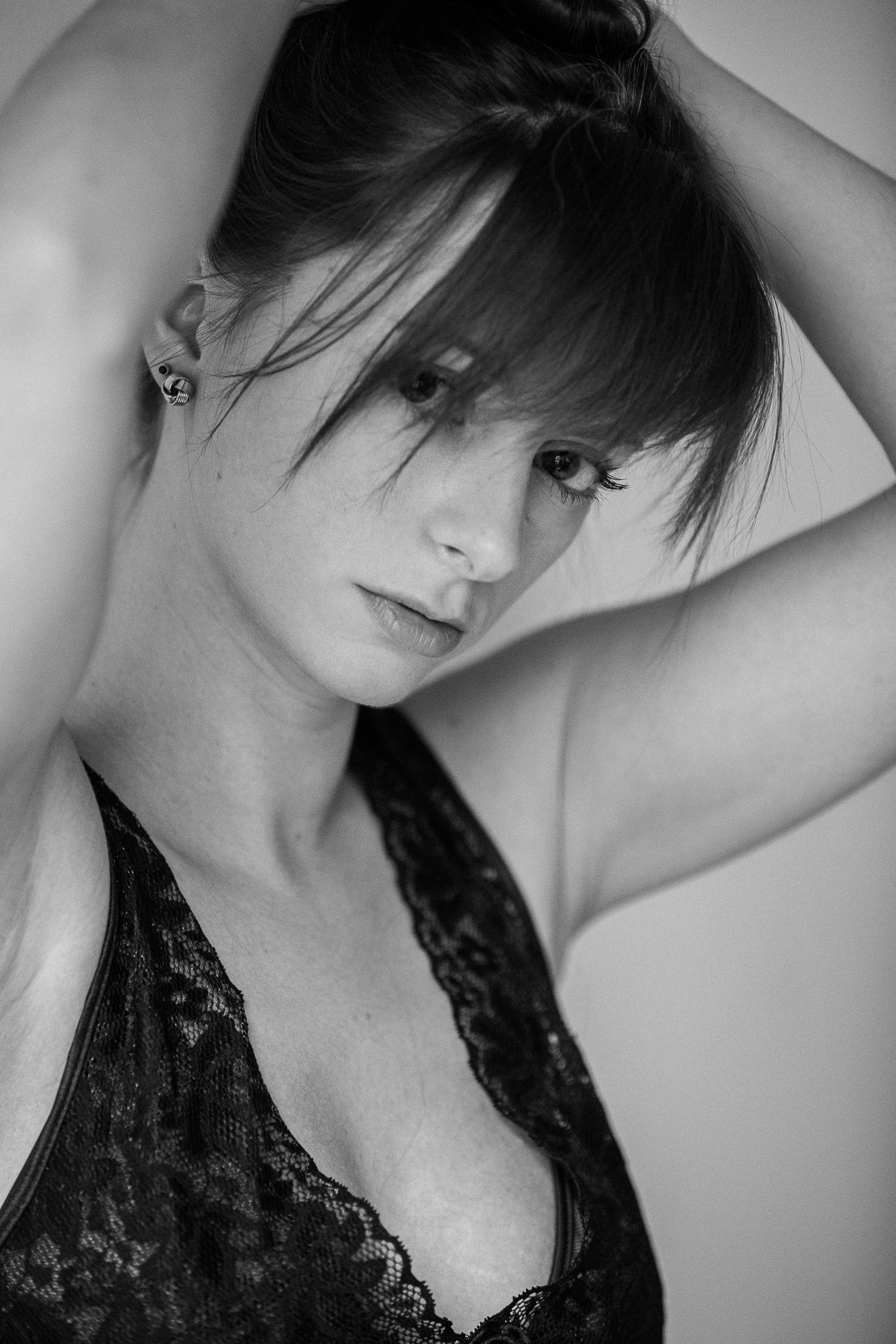 Artistic black and white portrait series with dramatic angles and expressions.