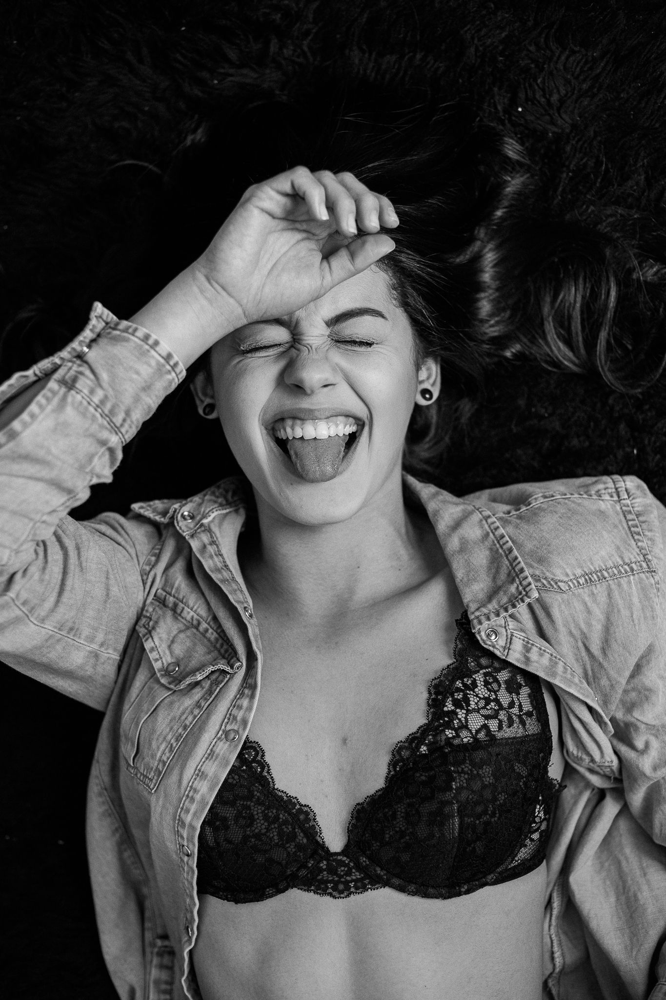 Black and white photo series showing playful expressions and a denim jacket against dark background.