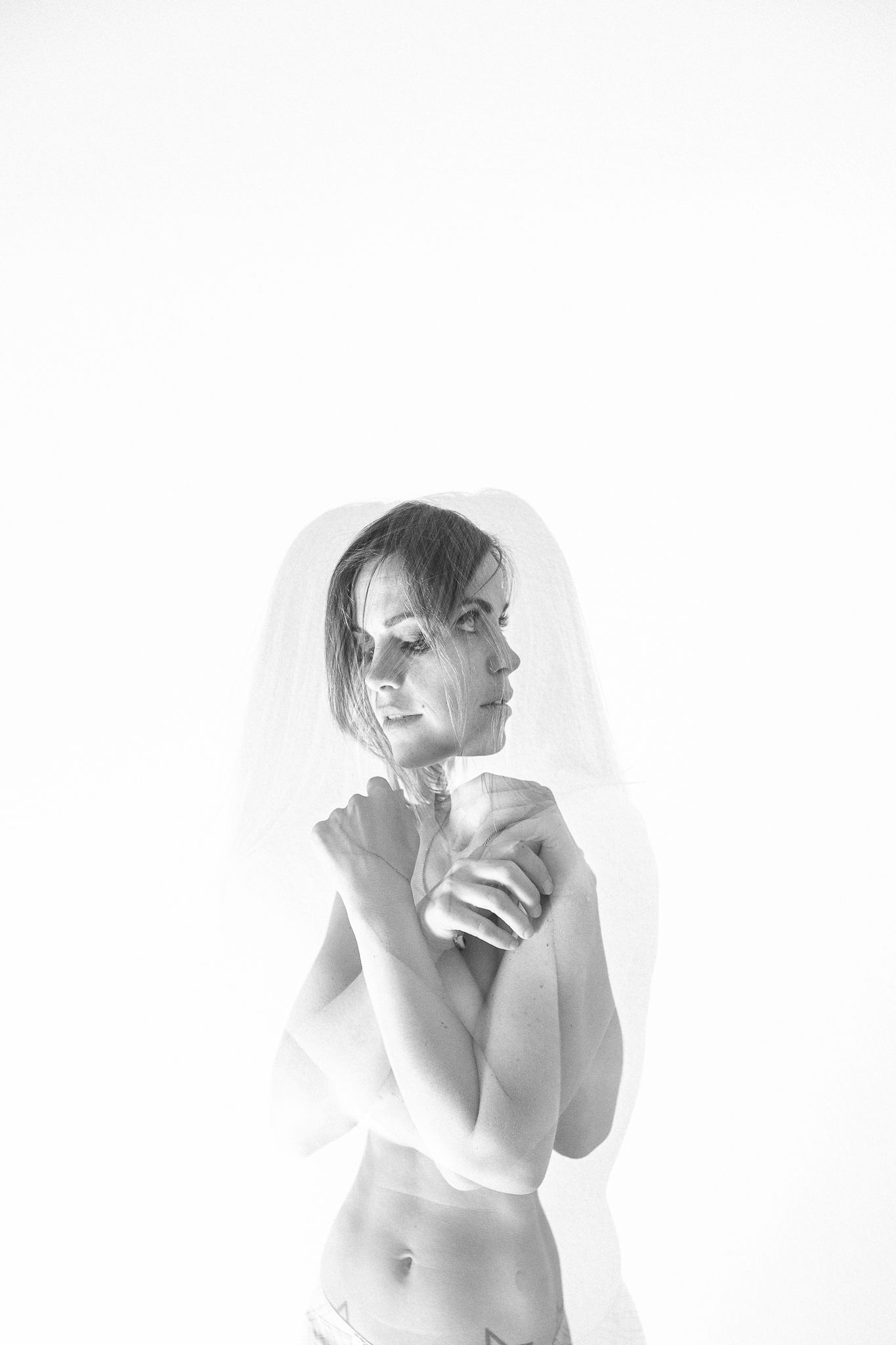 Black and white artistic portraits showing expressive poses against a white background.