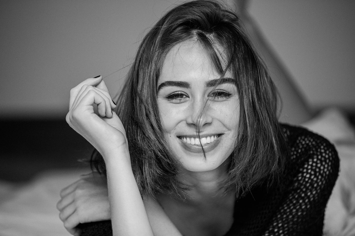 Black and white portrait sequence showing joyful expressions and natural poses.