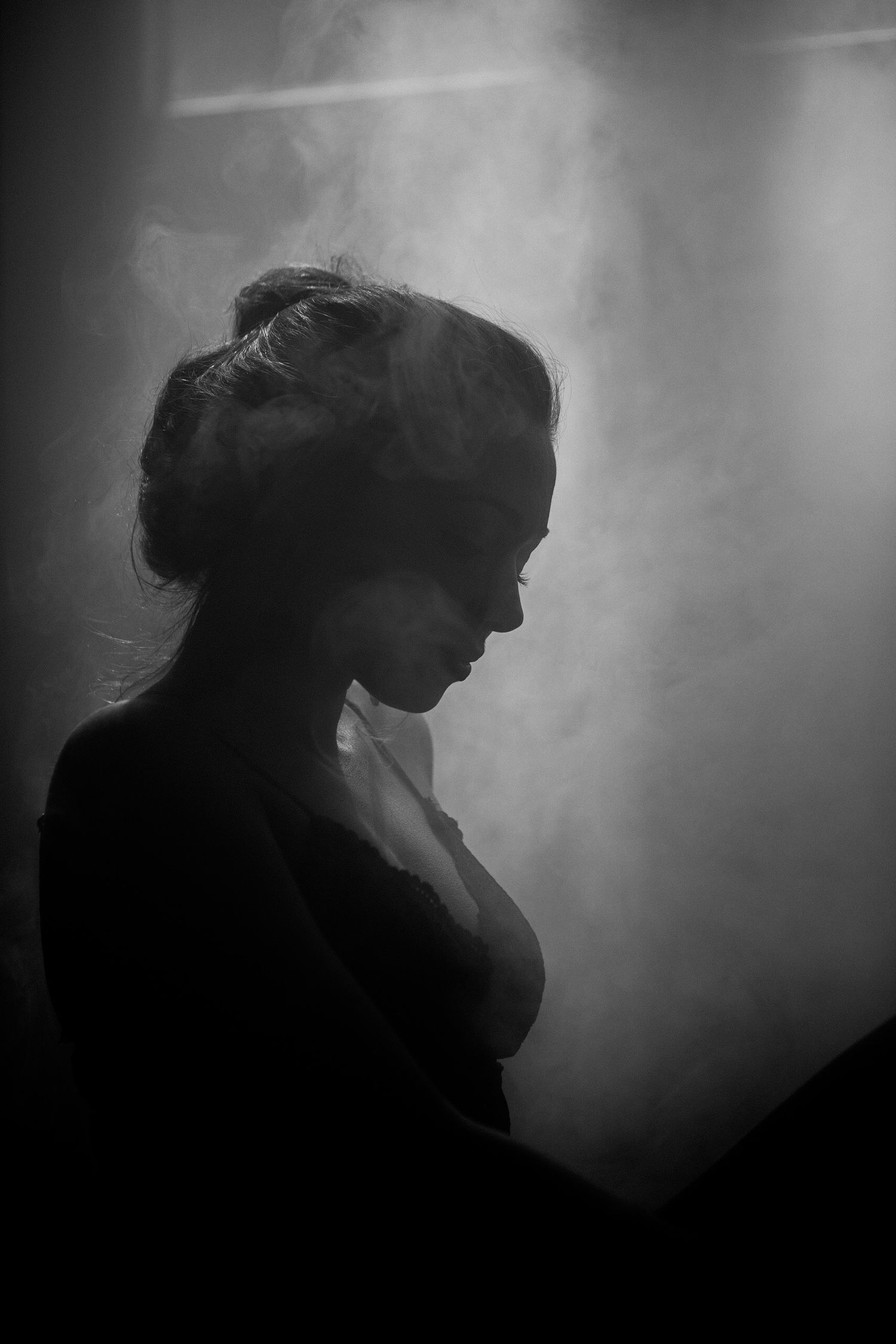 Atmospheric silhouette sequence with smoke effects in dramatic lighting.