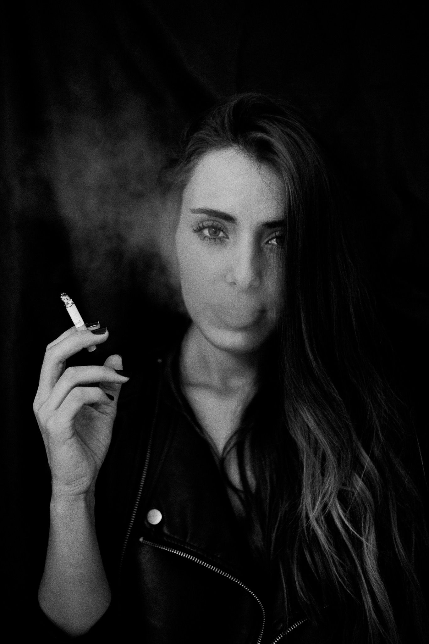 Dark moody portraits with cigarette smoke creating atmospheric effect.