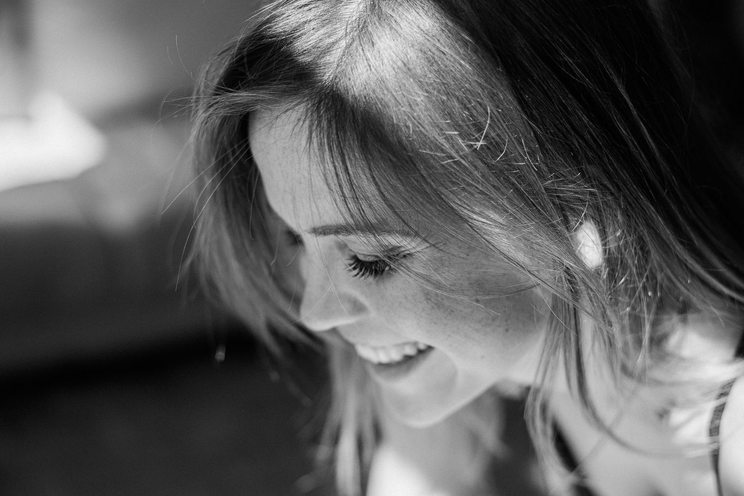 A series of black and white portraits showing a woman's profile and expressions in different poses.