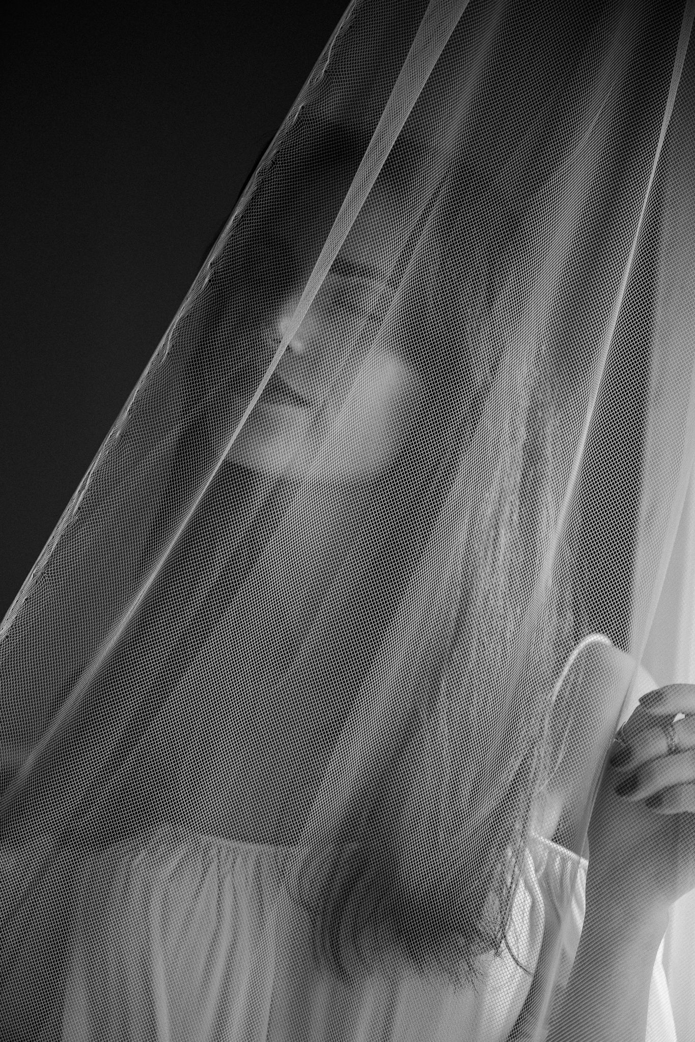 A series of blurred black and white photos showing motion of long hair and fabric in an artistic style.