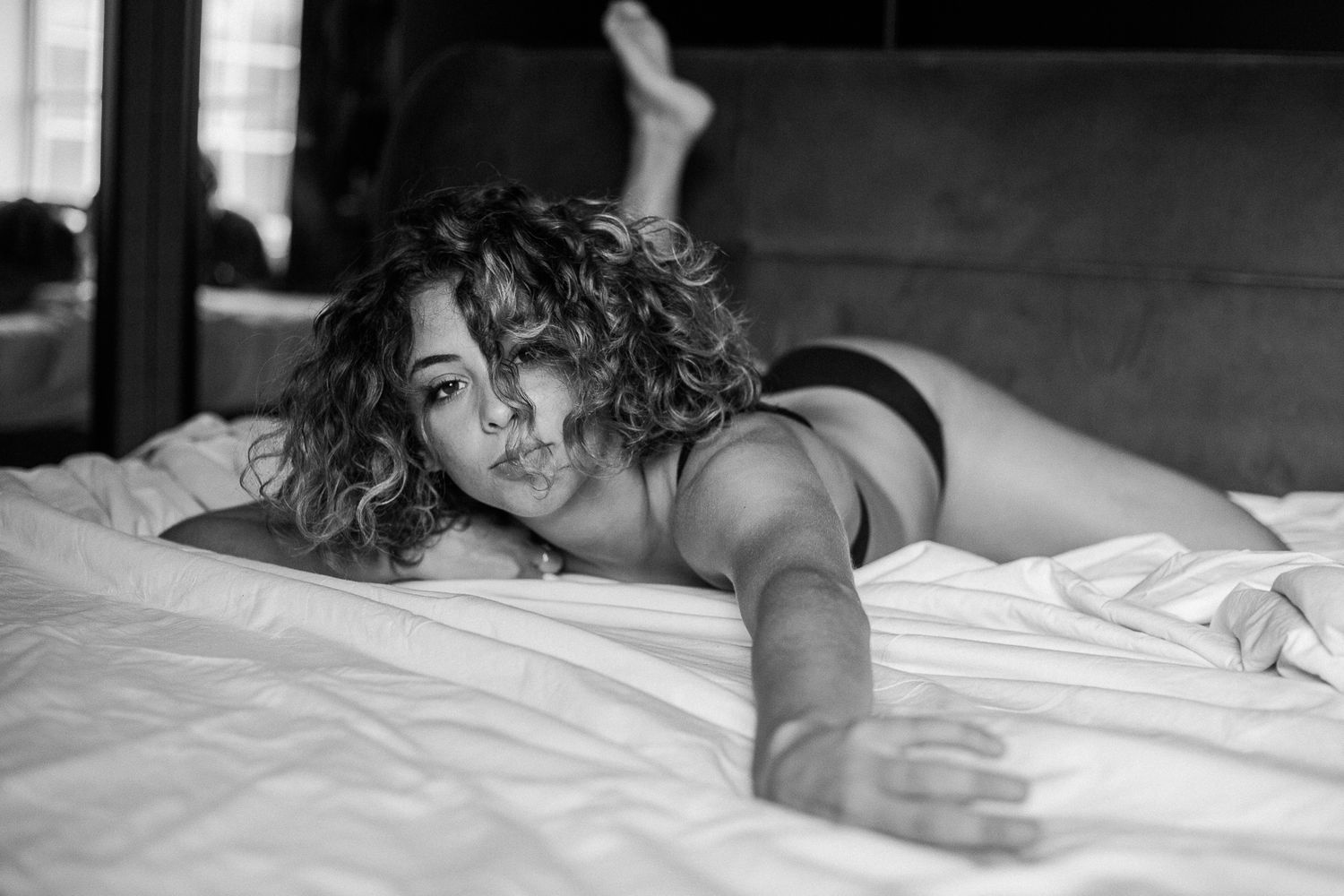 A sequence of black and white photographs showing a person sleeping peacefully in bed.
