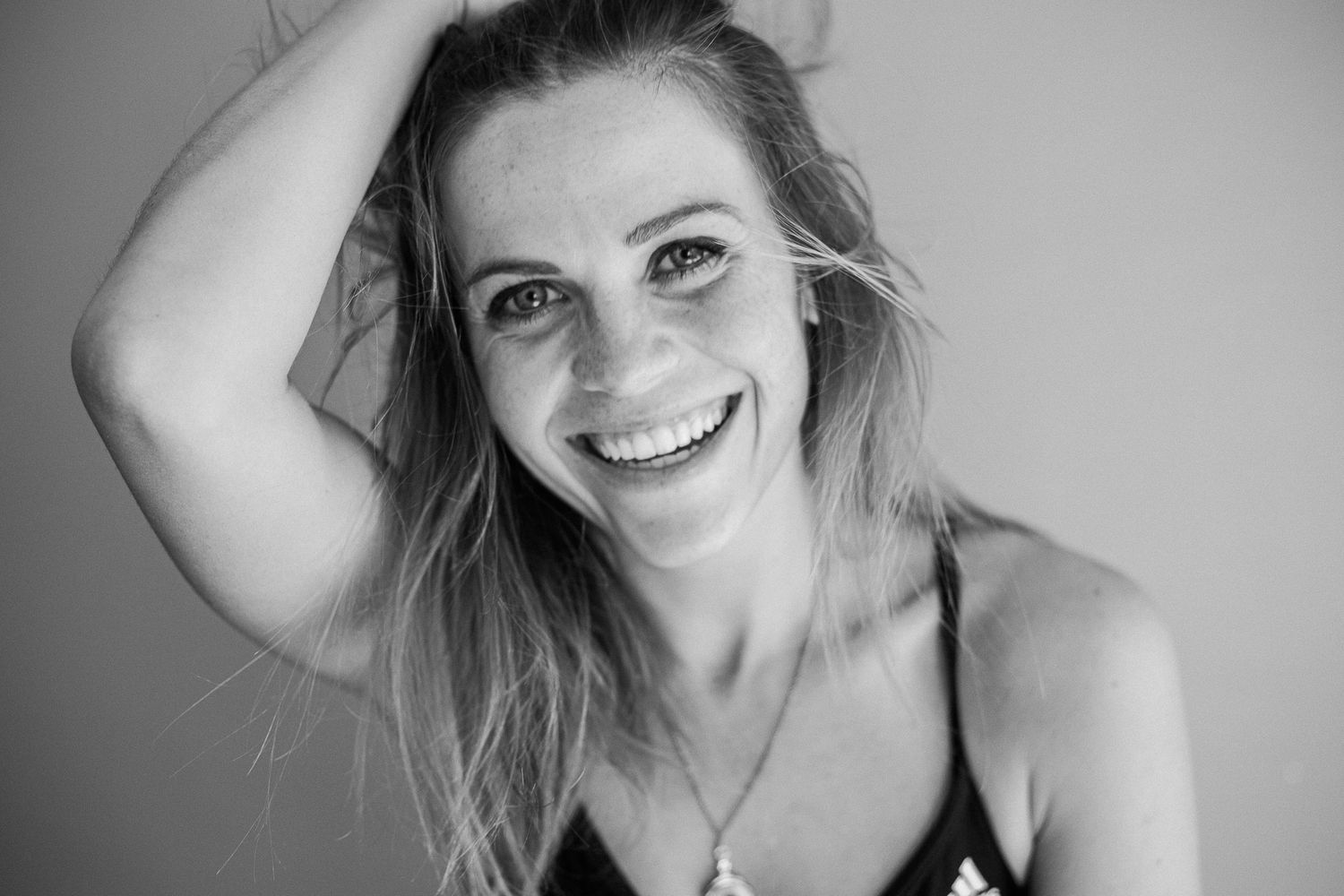 A black and white photo series showing candid expressions and natural poses in a casual portrait session.