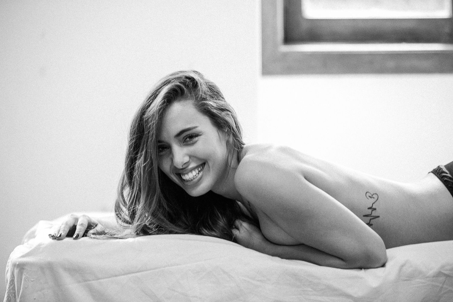 Natural light boudoir photography series in black and white.