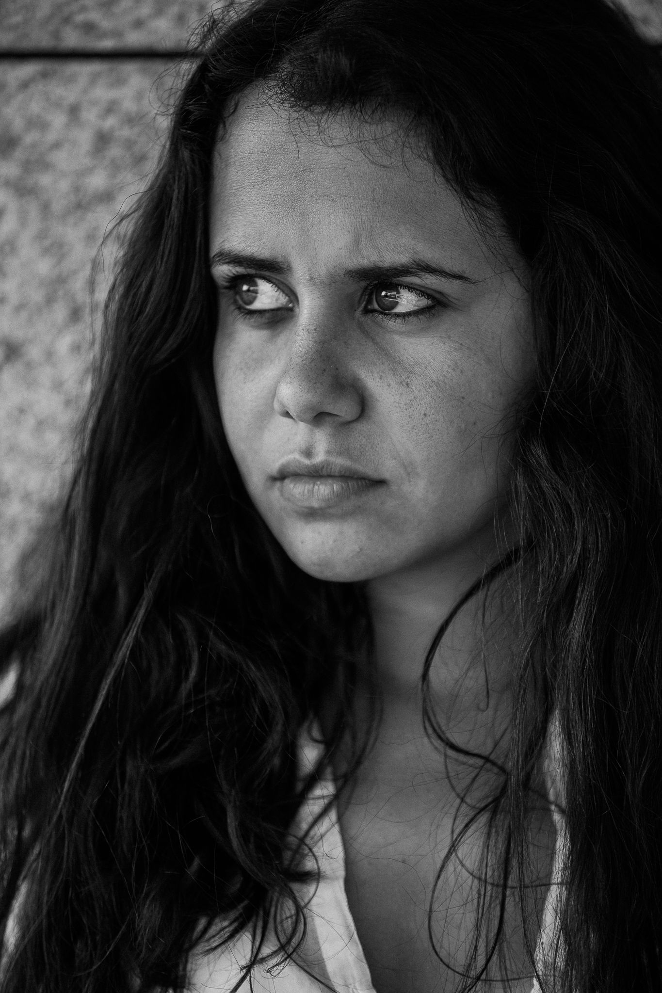 Dramatic black and white close-up sequence showing various emotional expressions.