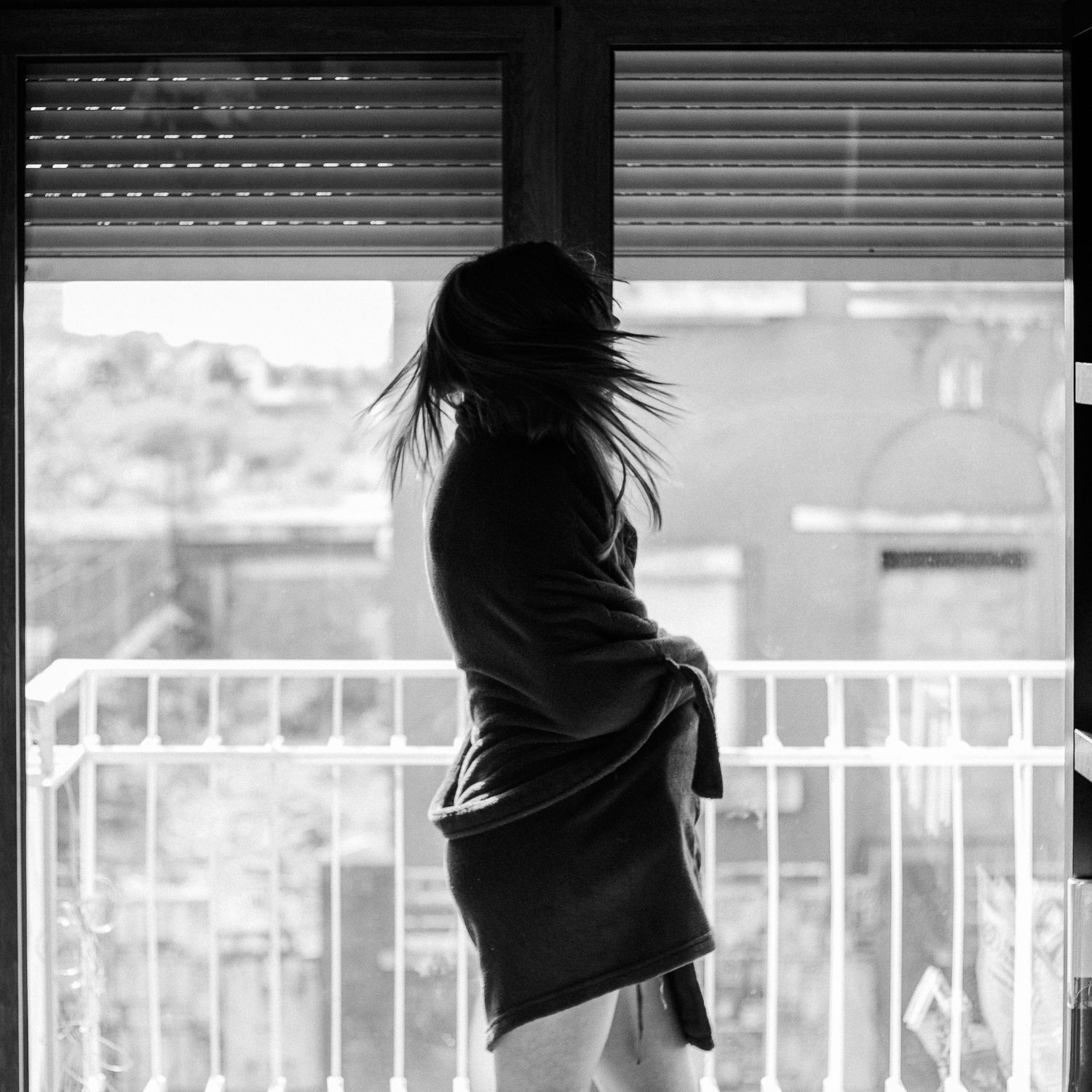 High contrast black and white series through window blinds creating dramatic shadows.