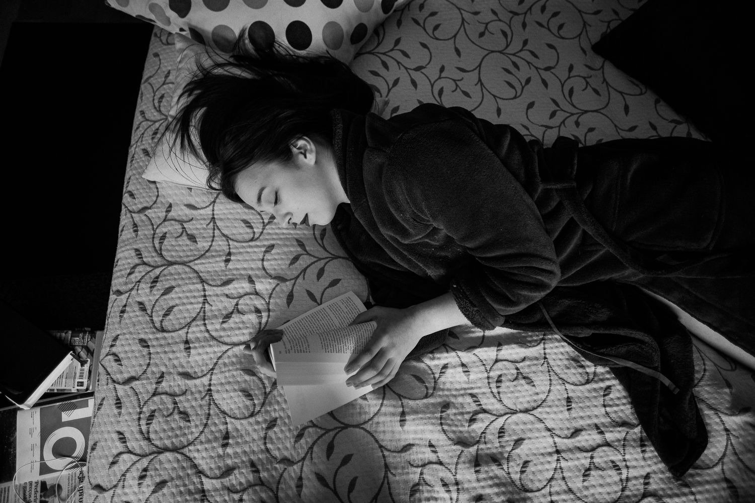 Intimate black and white photo sequence with geometric patterned background.