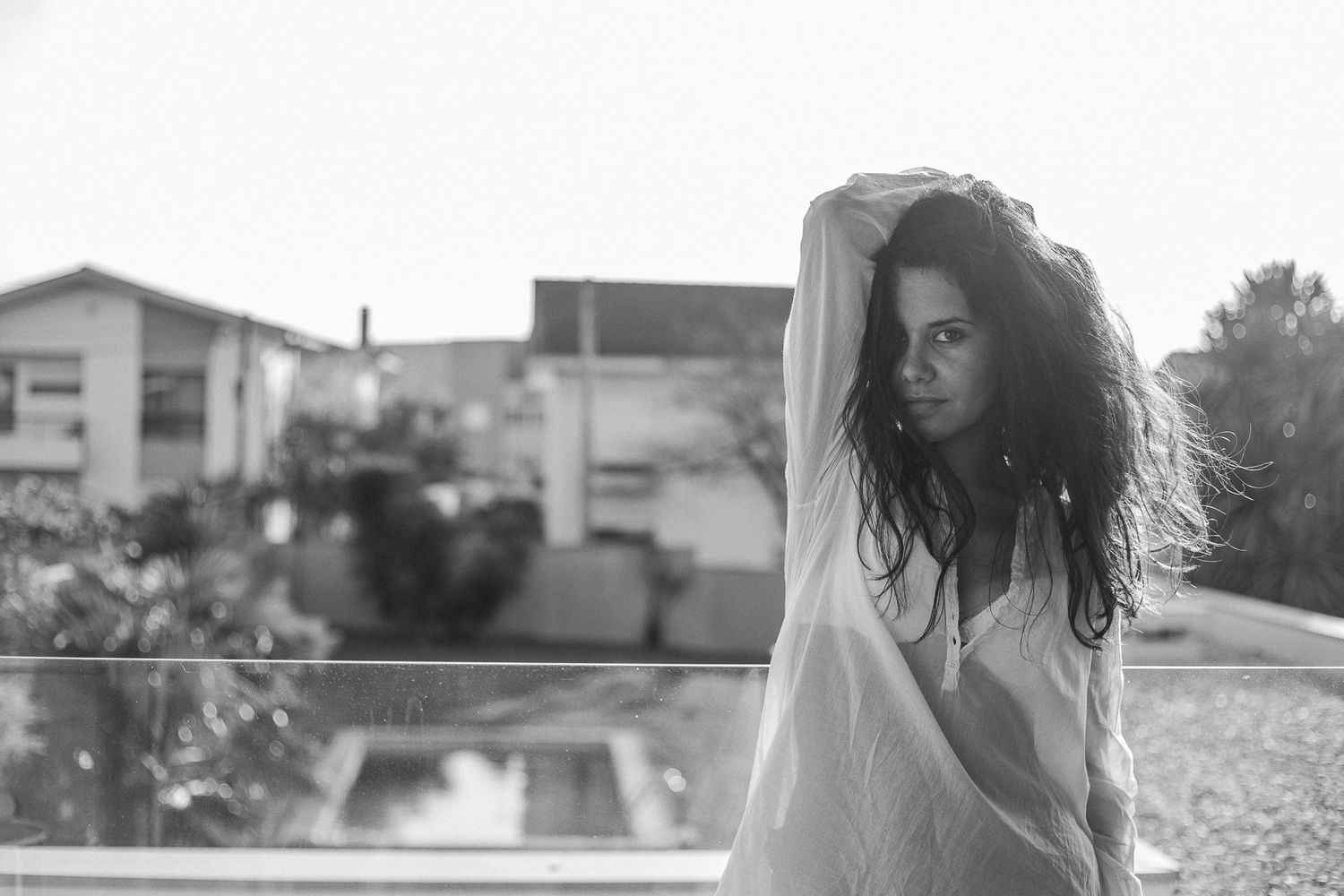Artistic outdoor photoshoot sequence with natural sunlight and urban background elements.