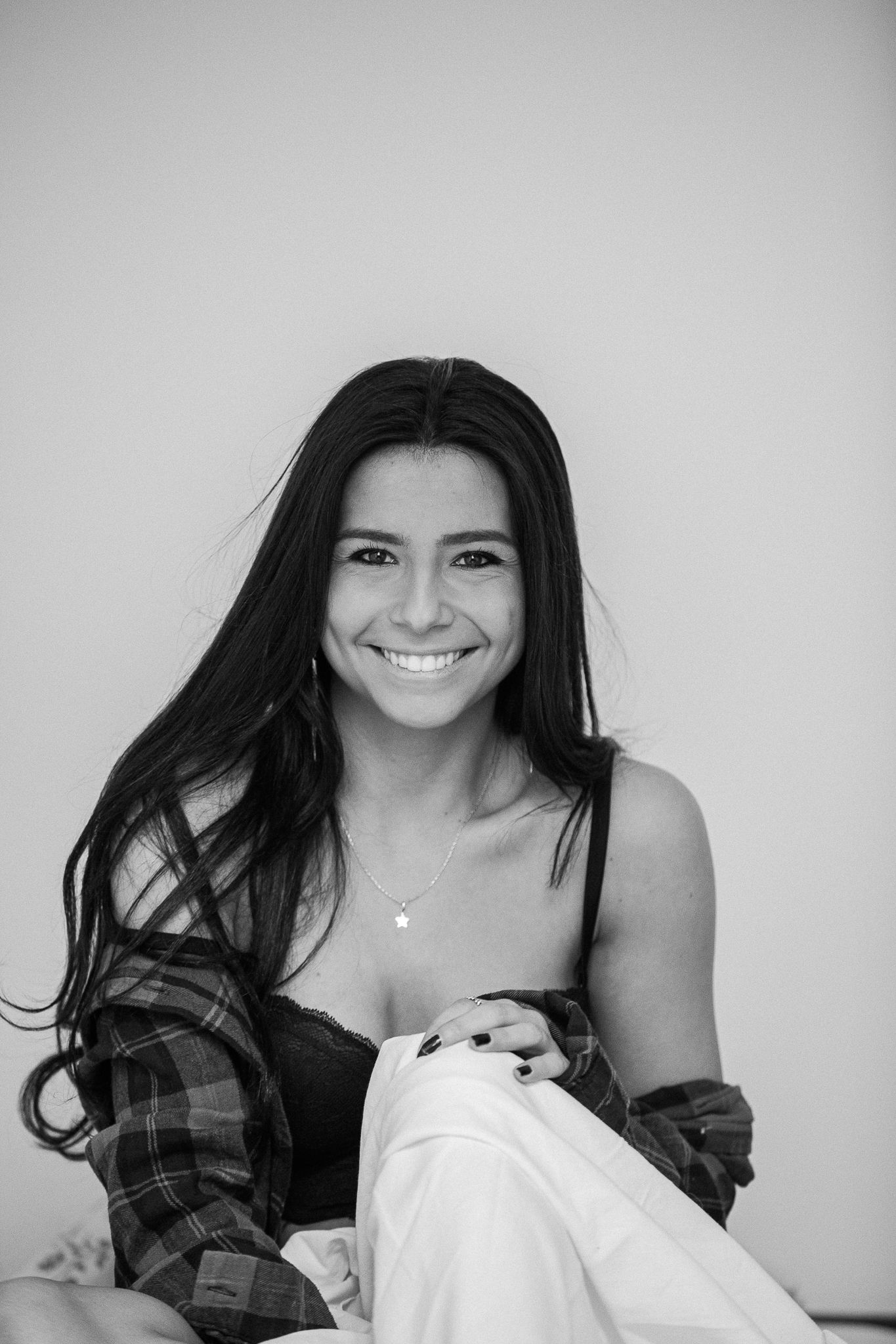 Casual portrait series featuring plaid shirt and natural expressions against white background.