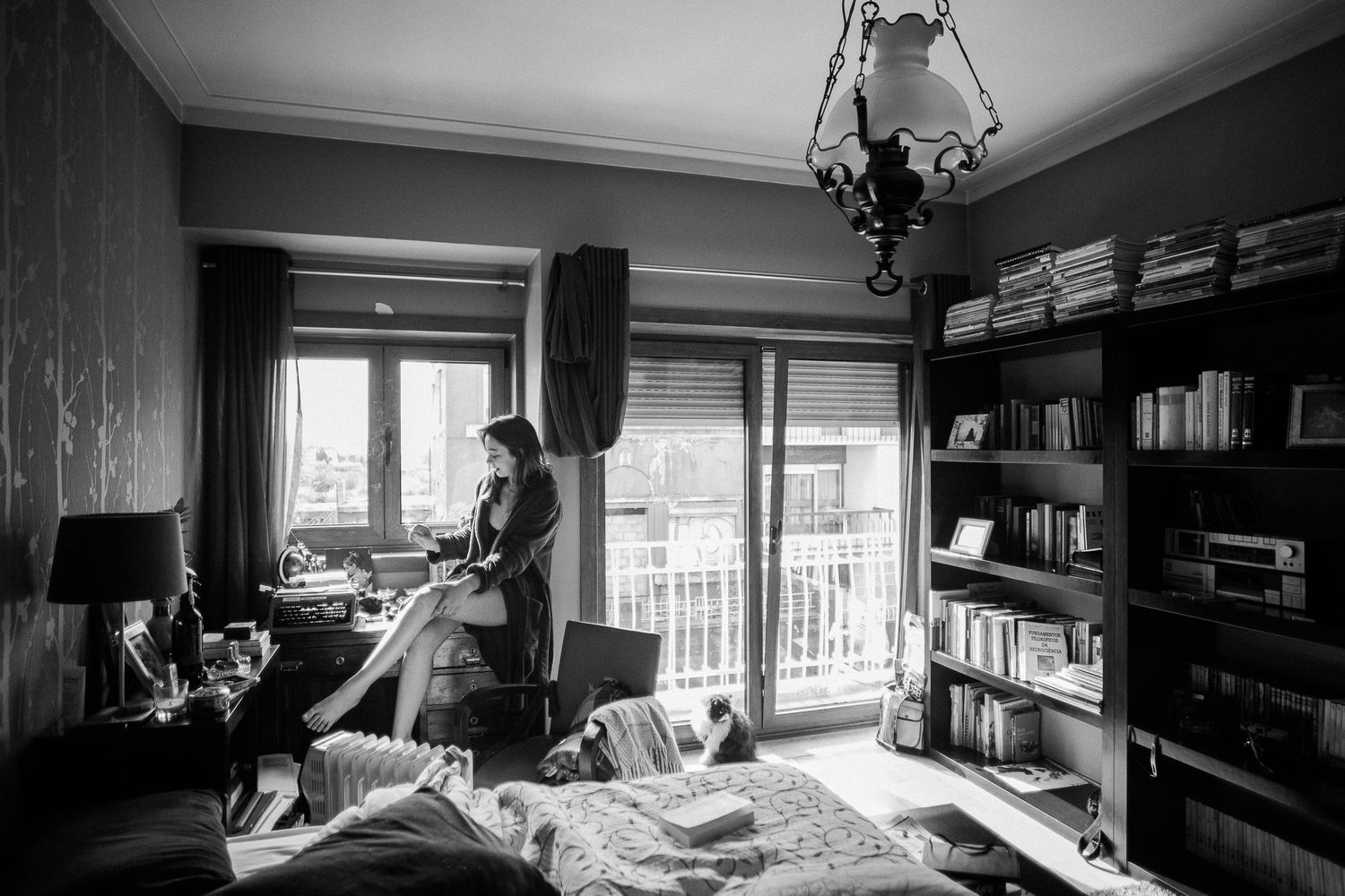 Moody black and white photo series showing a dimly lit interior room with window light.
