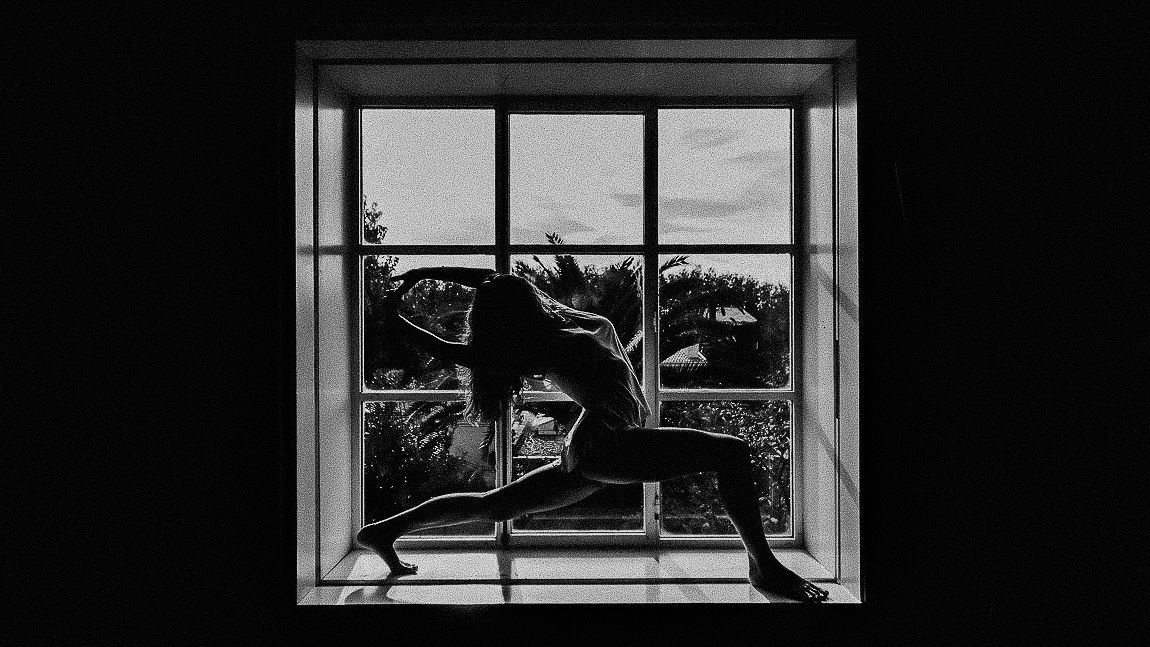 A series of five black and white photographs showing a cat silhouette sitting in different window frames.