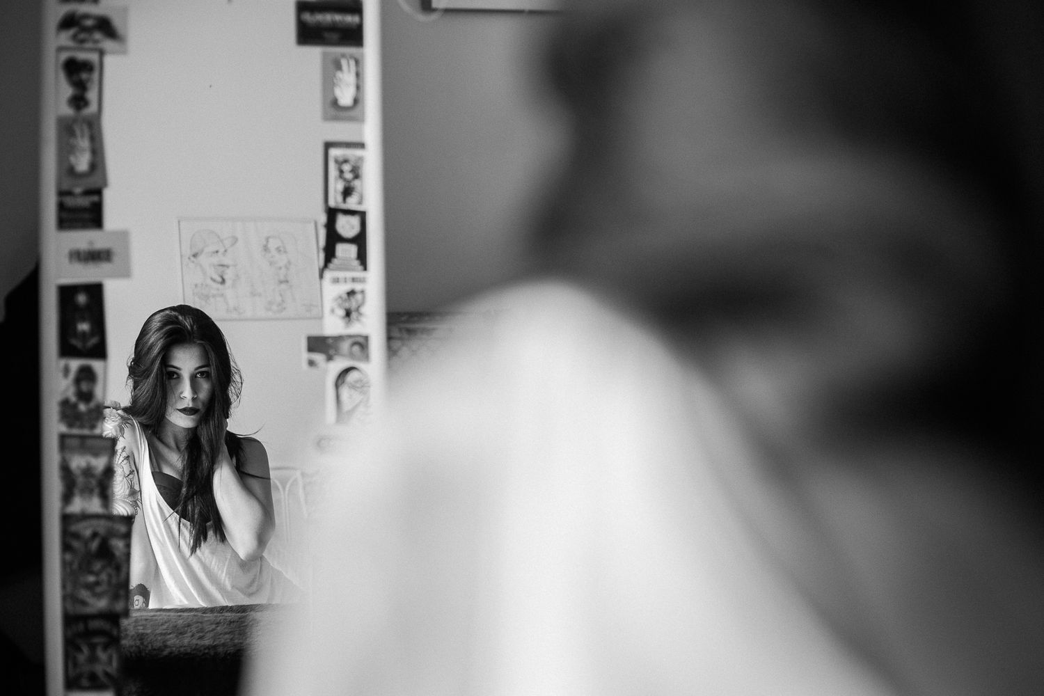 A series of black and white photo booth style portraits showing different facial expressions and poses.