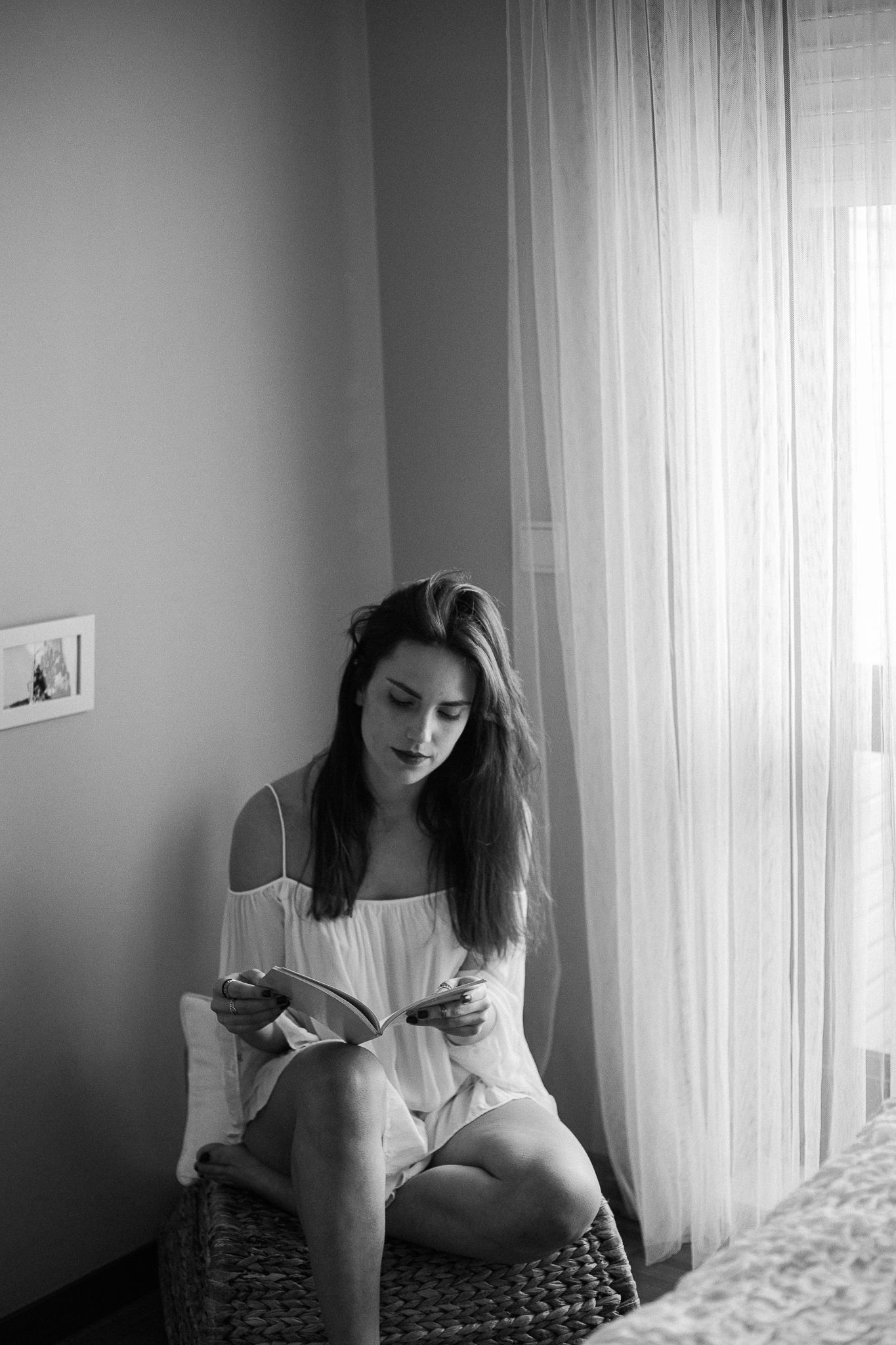 A black and white photo sequence shows a person sitting by a window in soft natural light.