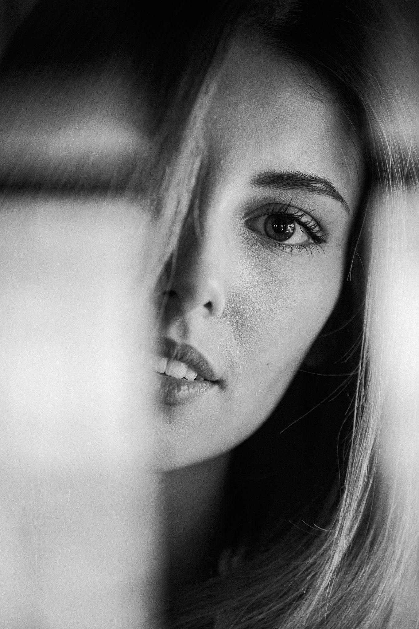Artistic black and white close-up portrait series with soft focus effects.