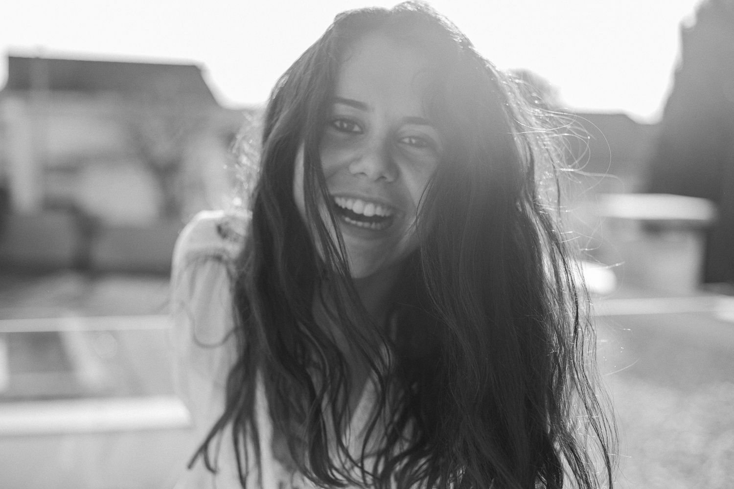 Sun-drenched portrait series with natural backlighting and joyful expressions.
