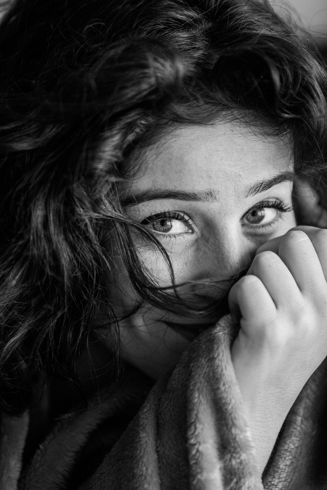 Dramatic close-up black and white portrait series focusing on eyes and hands.