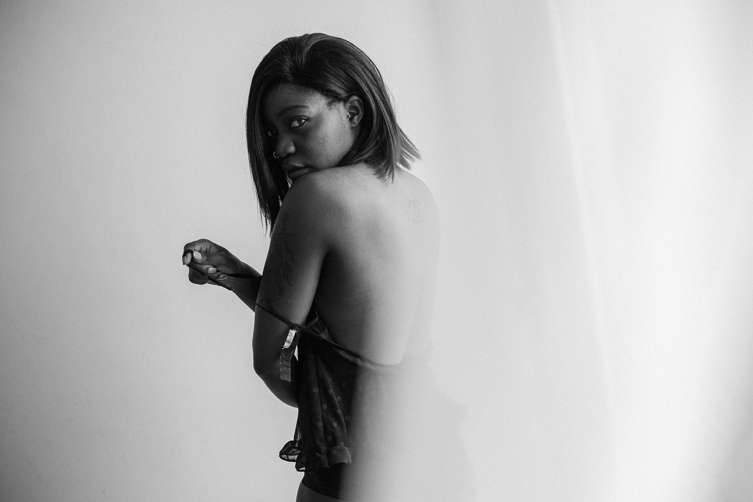 Black and white artistic portrait series showing graceful silhouettes and dramatic shadows against a light background.