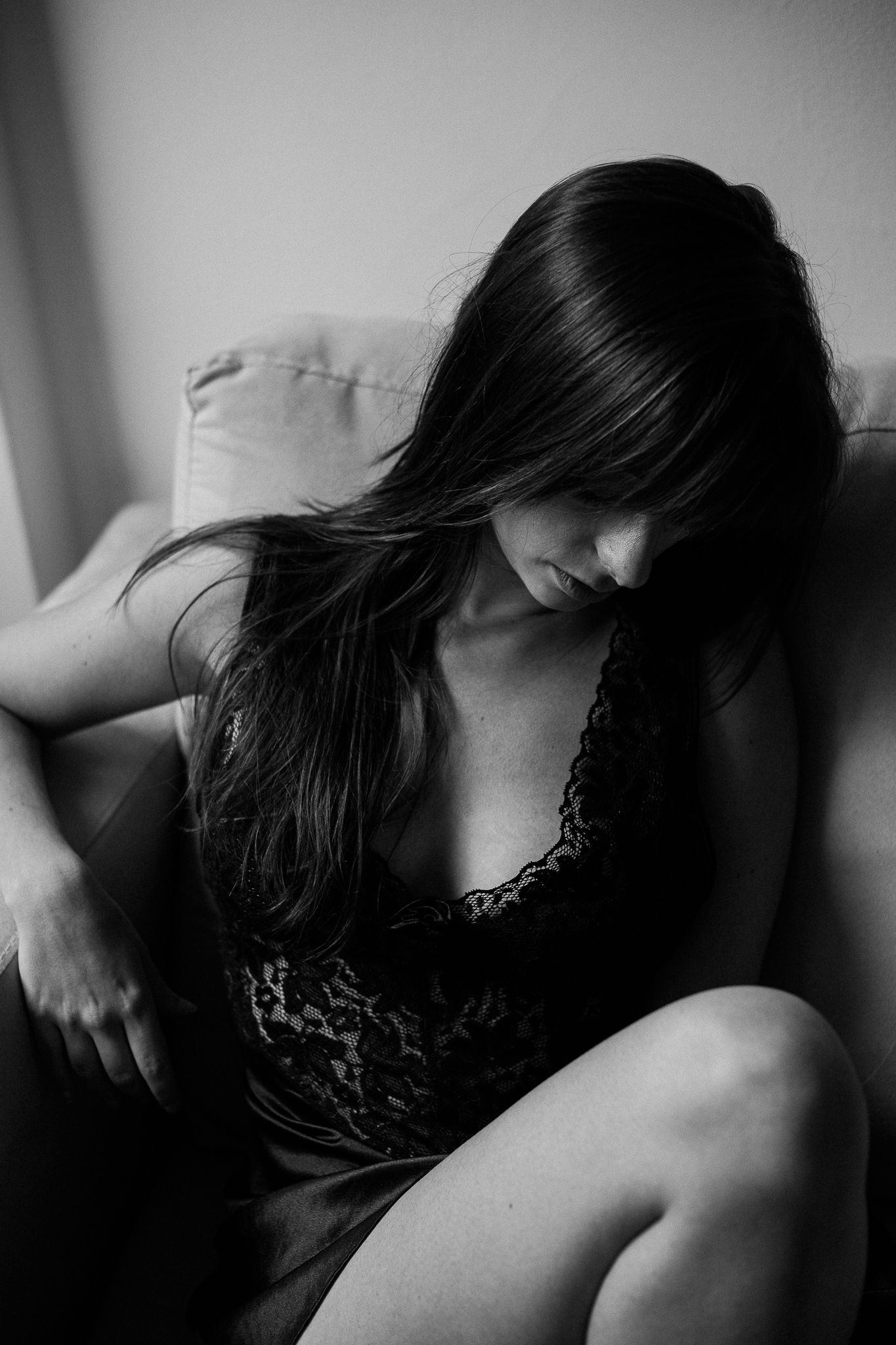 Intimate black and white portrait series with soft lighting and dark tones.