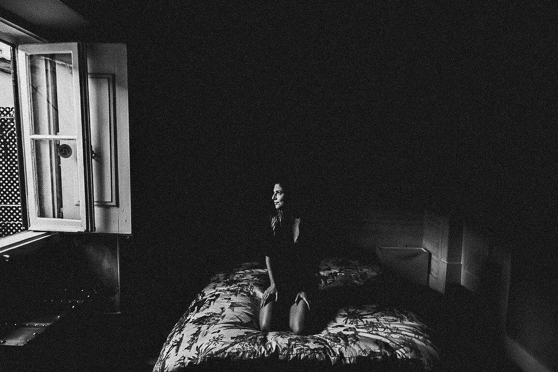 A dramatic black and white photo series showing open windows with light streaming in and casting shadows.