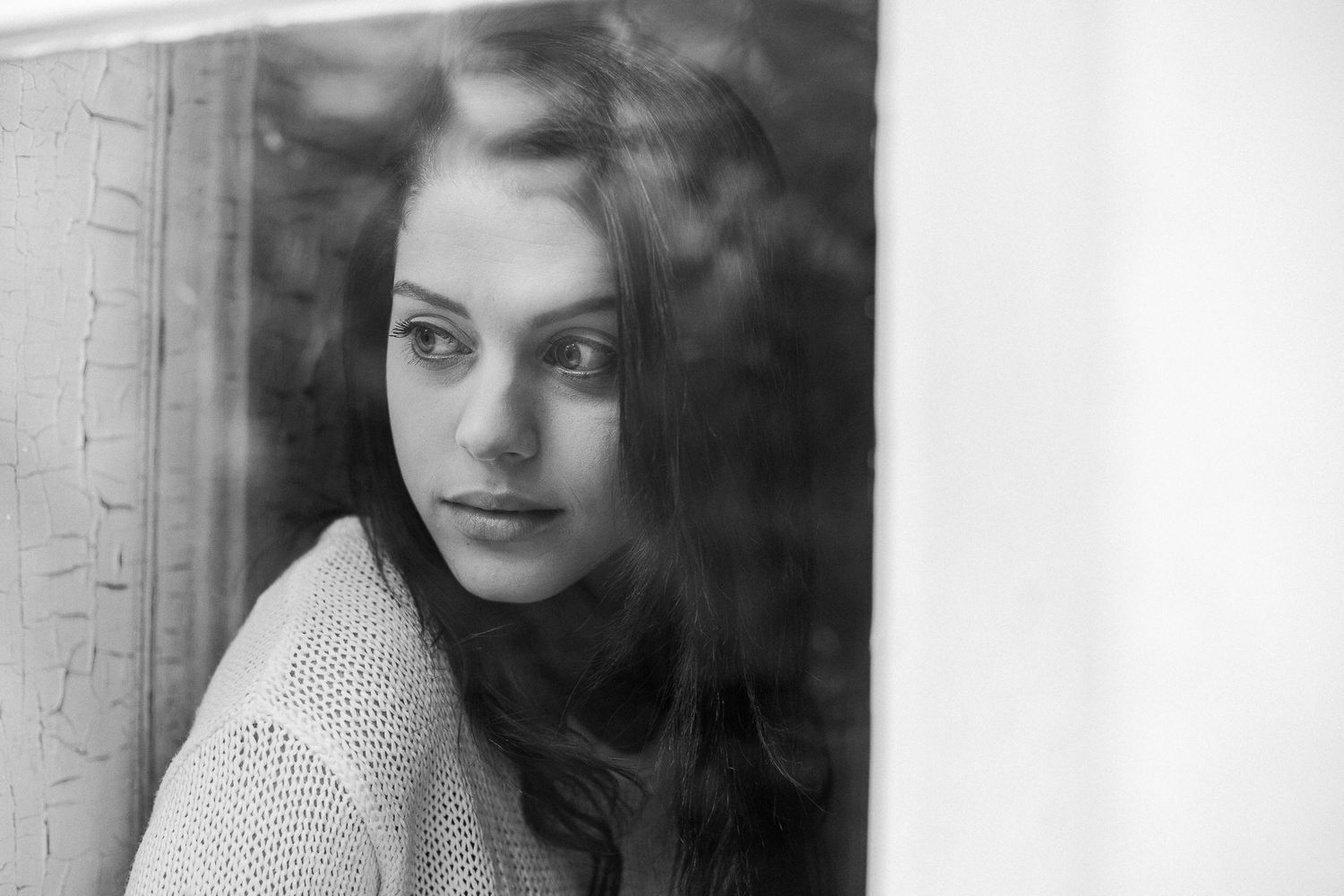Vintage black and white portrait series showing different expressions and angles in polka dot attire.