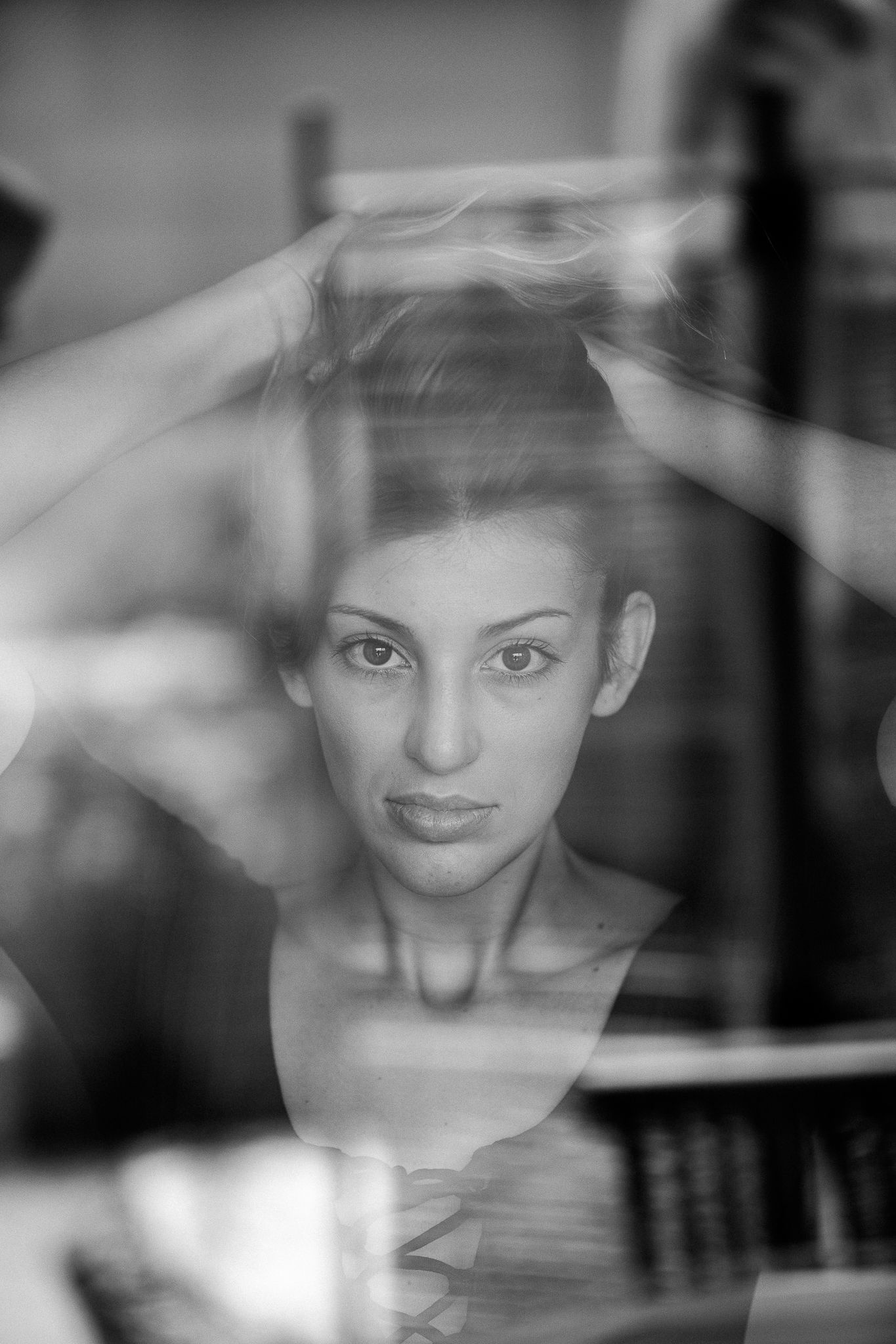 Multiple exposure portrait creating ethereal overlapping effects in black and white.
