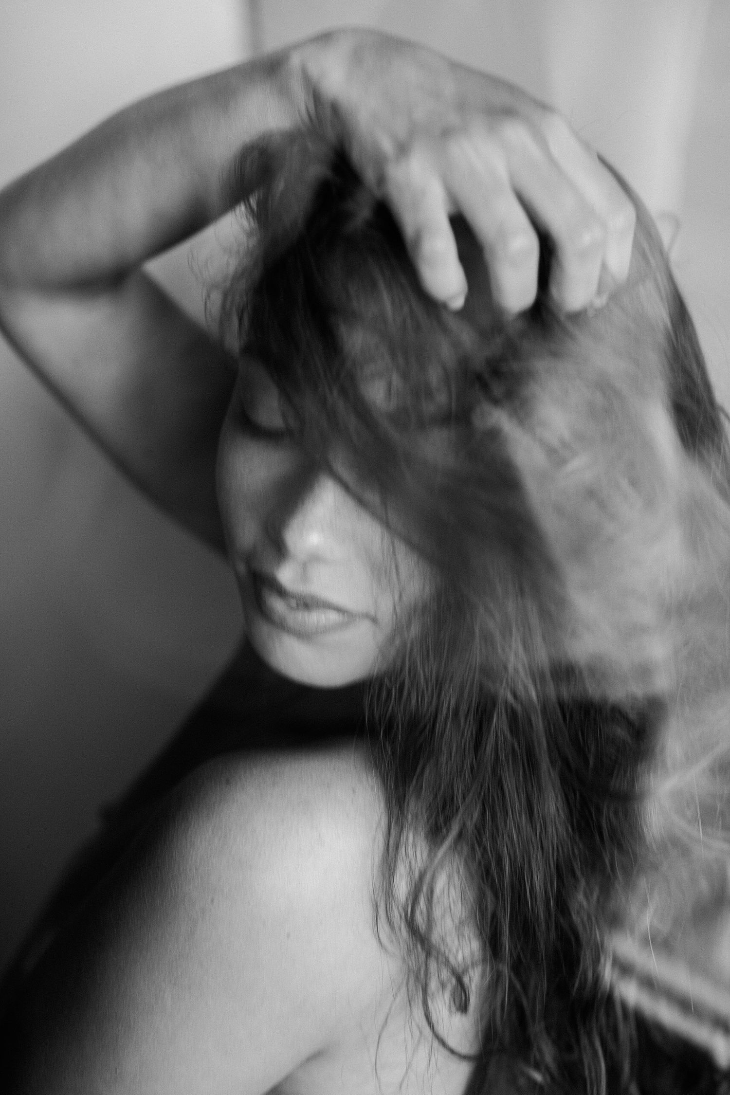 Dynamic black and white series showing hair in motion with dramatic lighting effects.