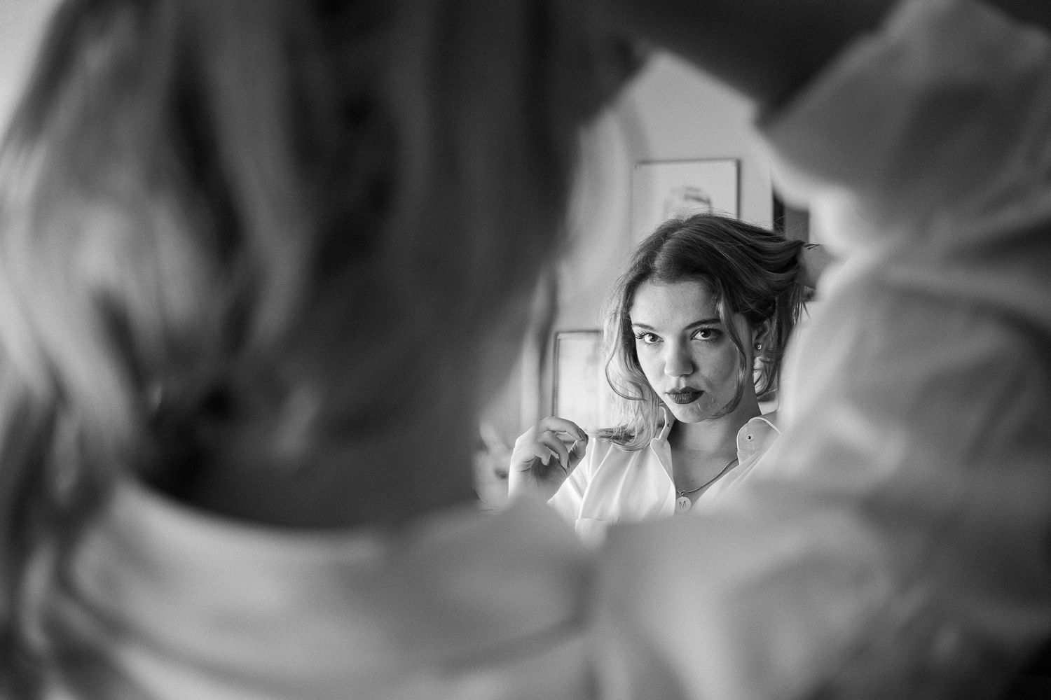 A black and white film strip montage showing dramatic portrait shots in moody lighting.
