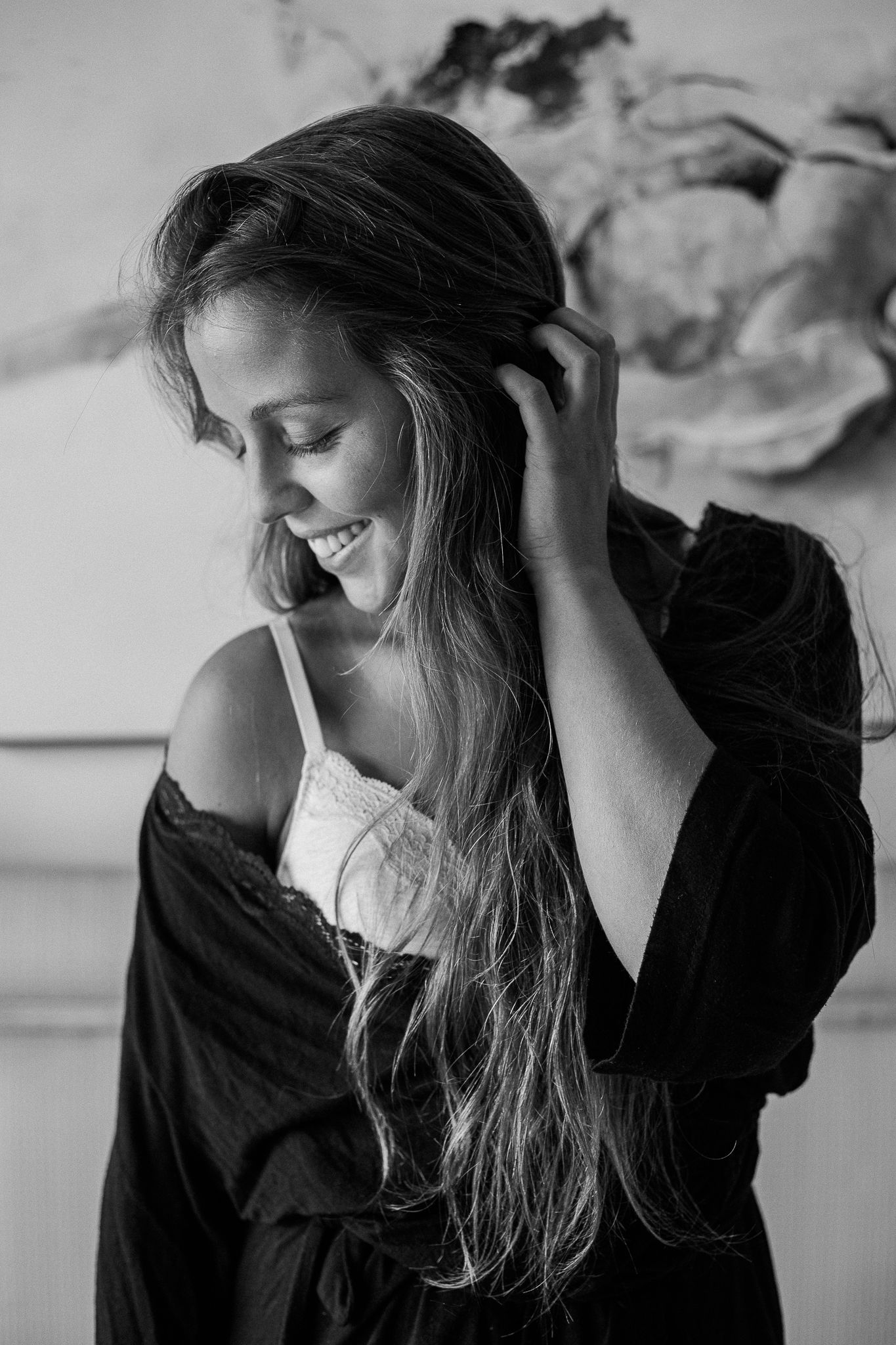 Black and white portrait series showing a person with long hair in a dark shirt looking down with changing expressions.