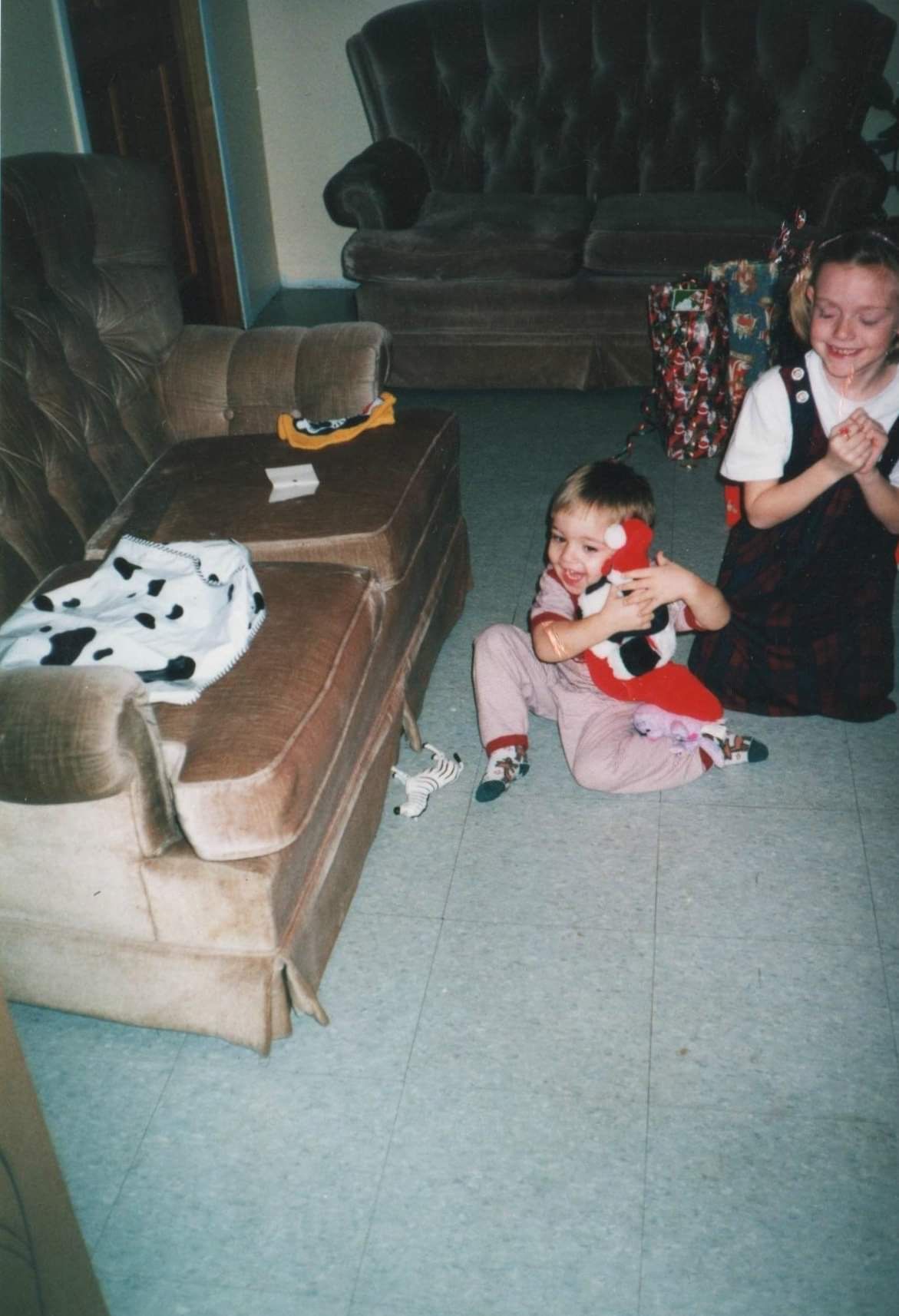 A sequence of photos showing a child playing with a spotted plush toy on a beige carpet near a couch.