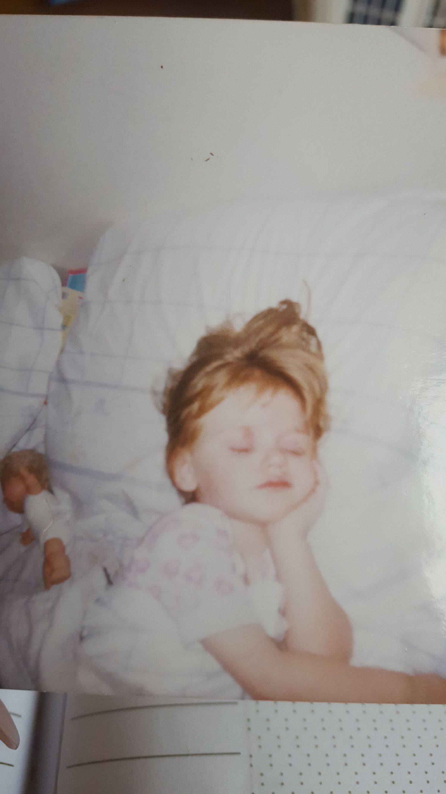 A sleeping baby rests peacefully on white bedding in a series of vintage-style photographs.