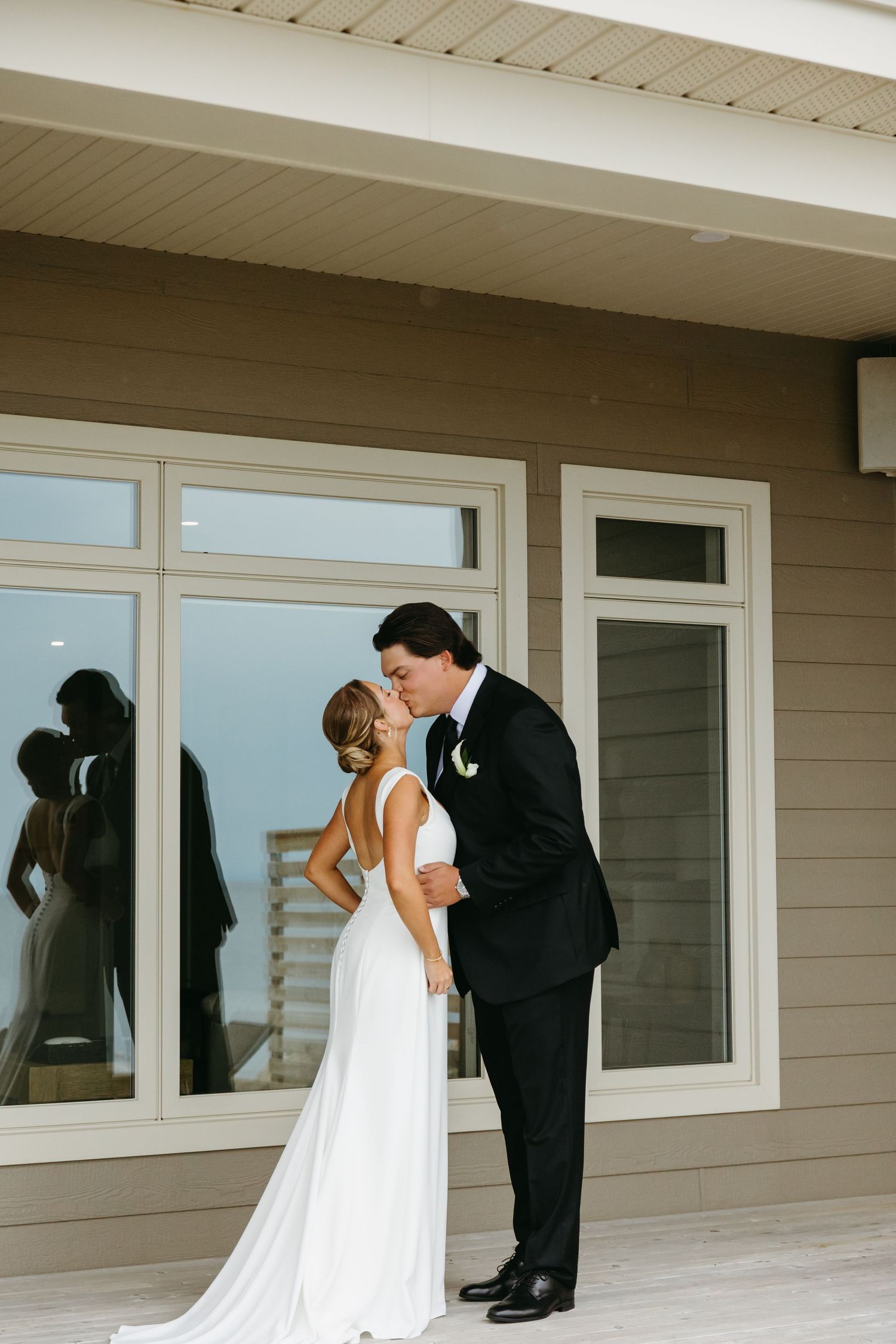 A series of wedding photos showing tender moments between a couple in formal attire on a covered porch.