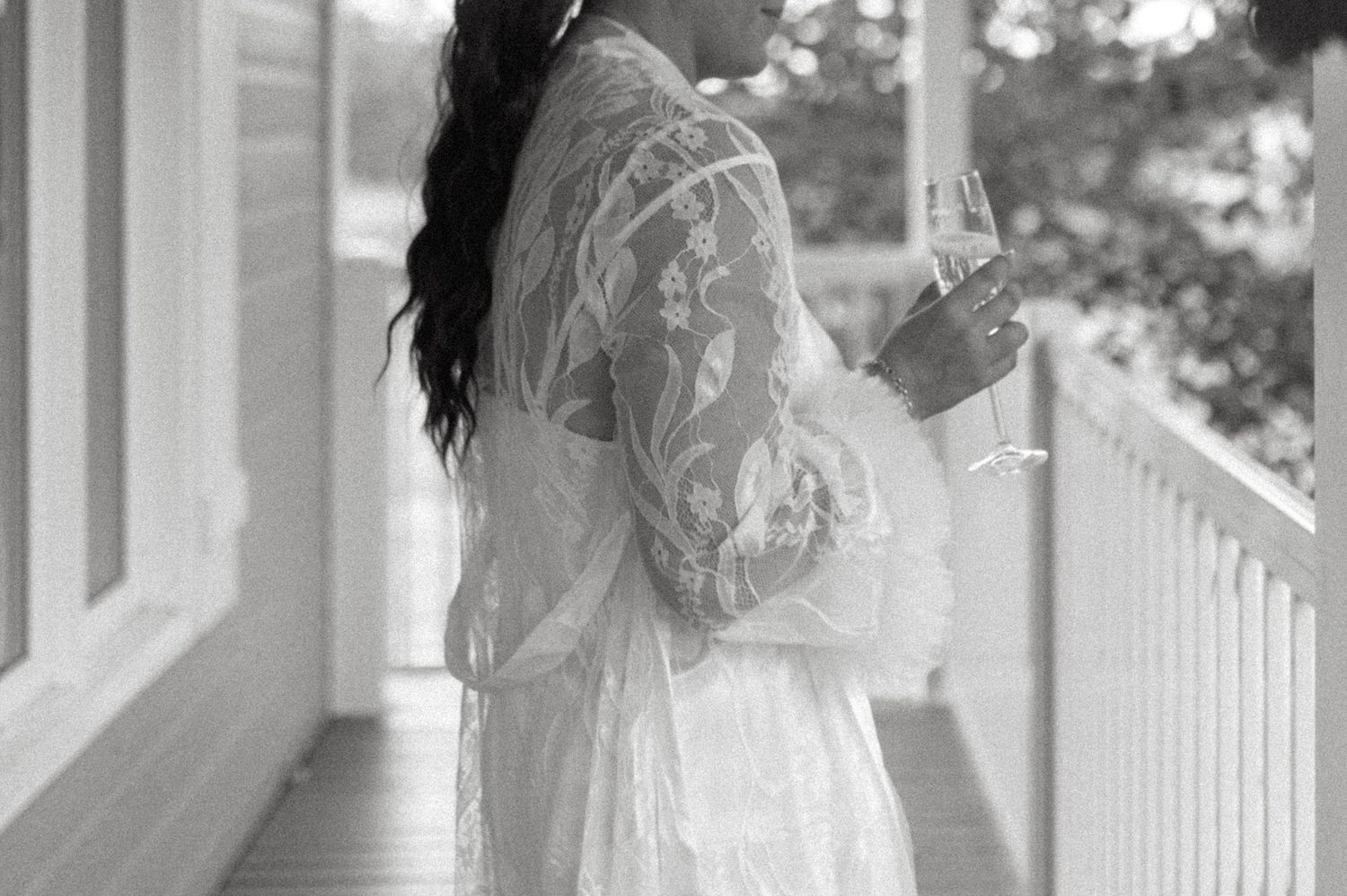 Black and white photo series showing a bride in her wedding dress posing elegantly on a porch with white columns.