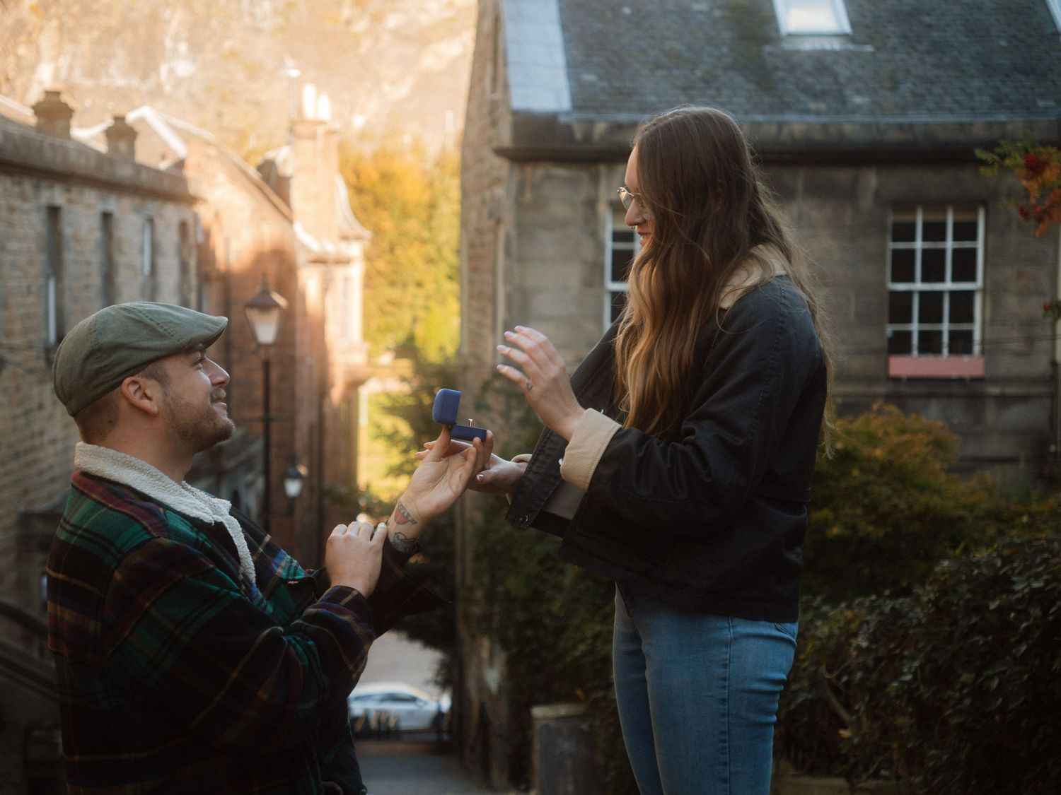Series of intimate photos showing a couple embracing in front of historic stone architecture at sunset.