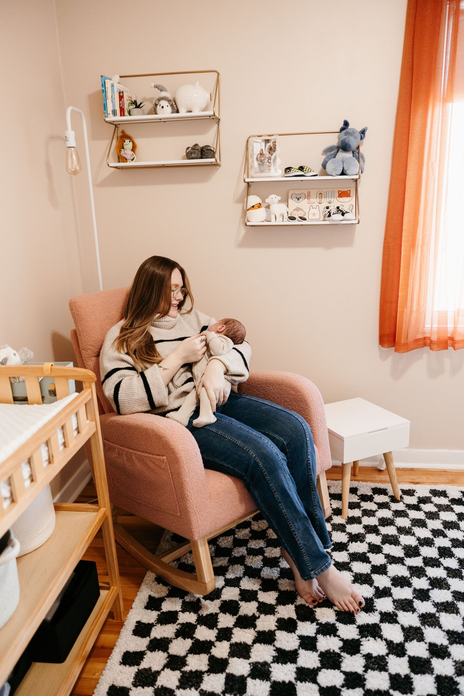 Three sequential images show someone resting in a pink armchair on a black and white checkered floor in a cozy room.