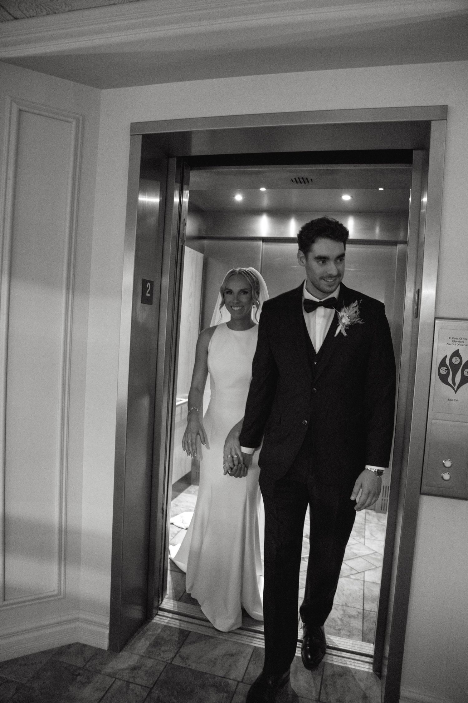 A black and white photo series showing a person in formal attire standing by different elevator doors.