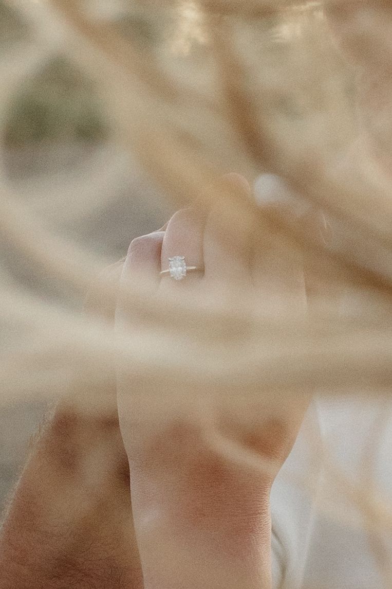 Close-up of an engagement ring with soft dreamy bokeh effect.