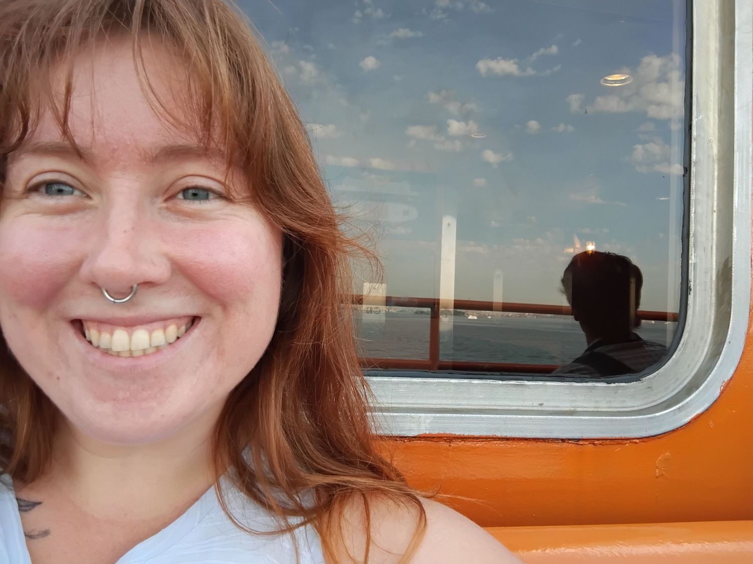 Selfie of Shay Godfrey smiling on a boat while traveling outside of colorado