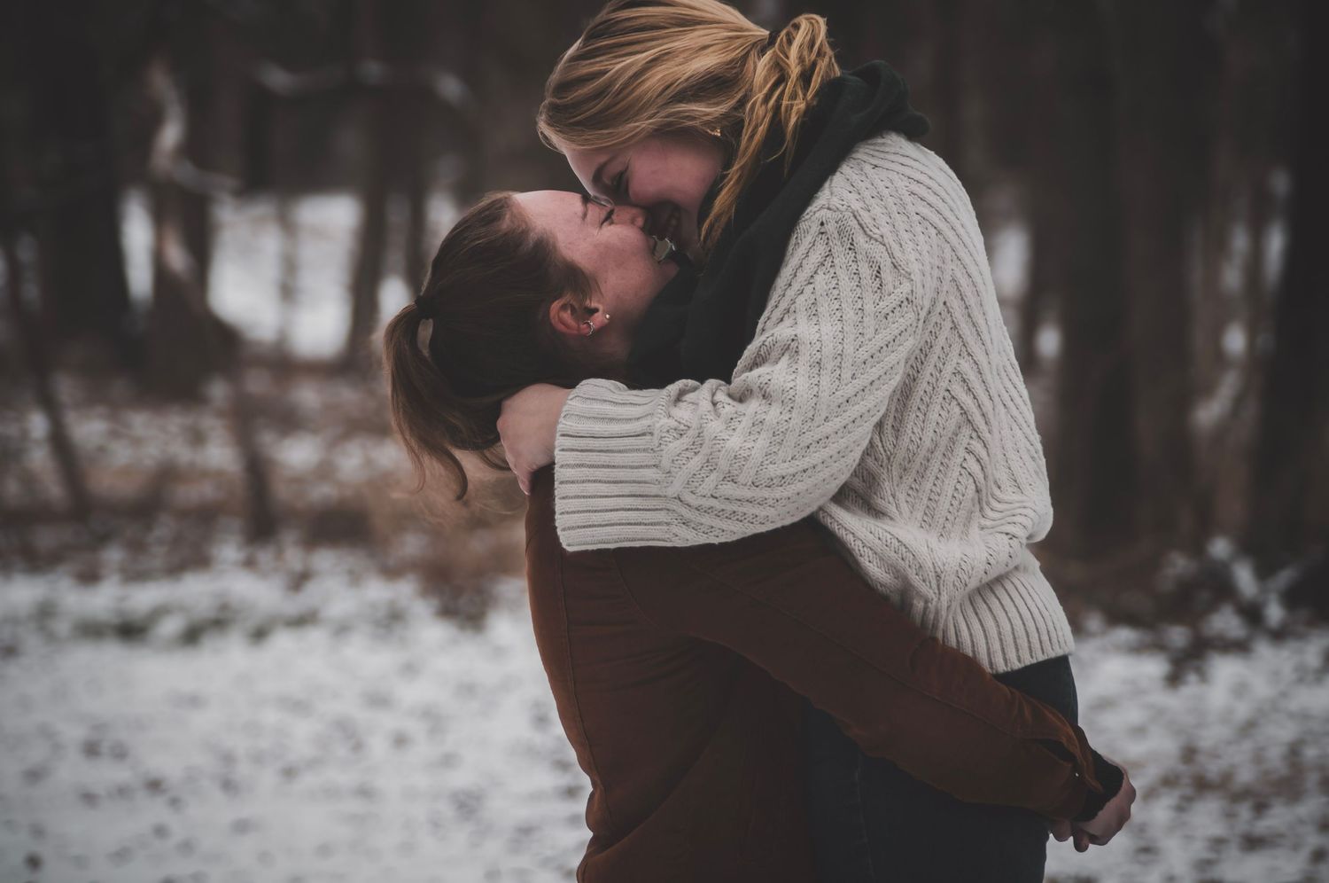 Shay Godfrey capturing a loving, authentic moment between a queer couple outdoors in Colorado