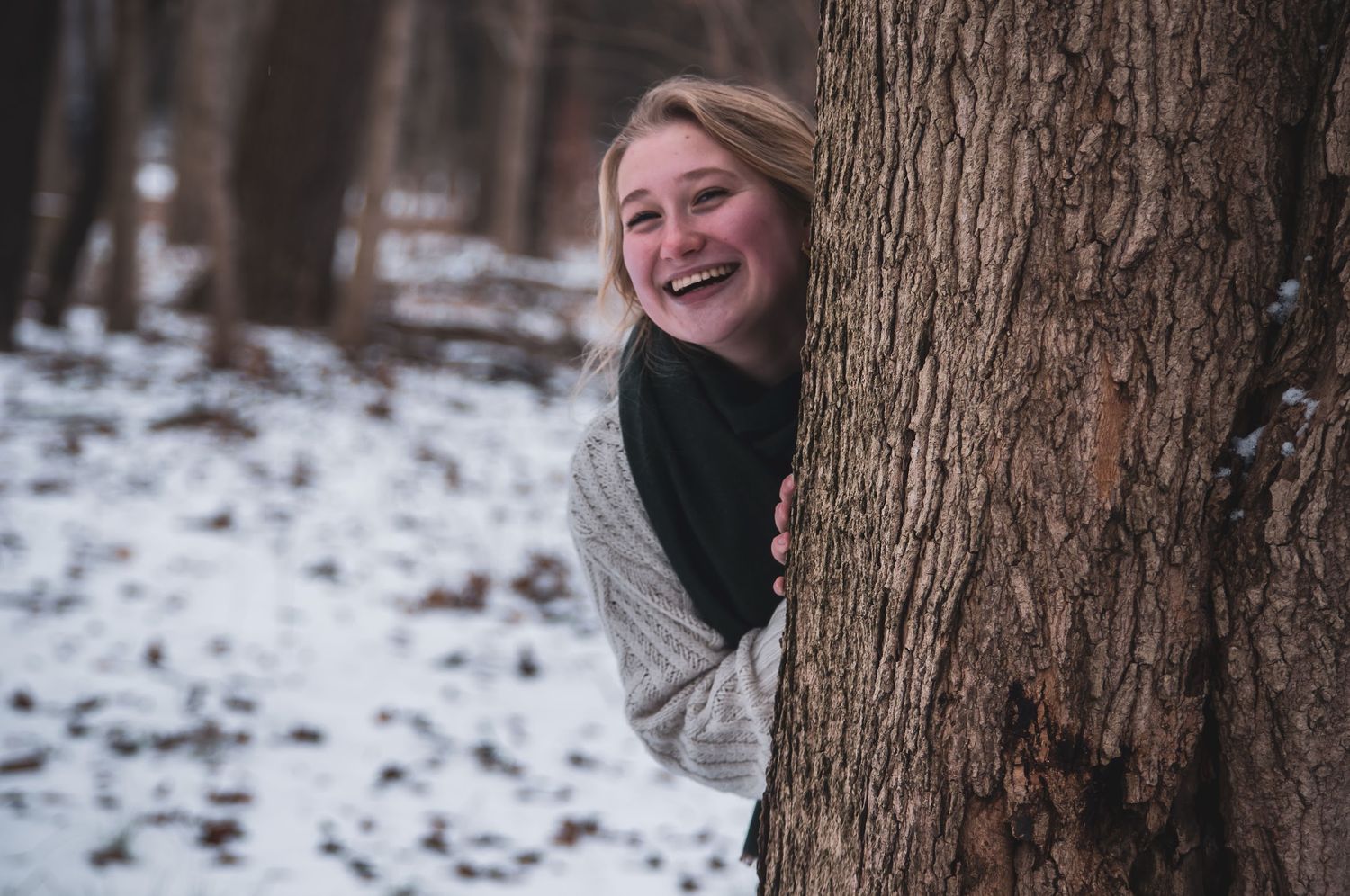 Outdoor portrait in the snowy woods capturing candid emotions and awe